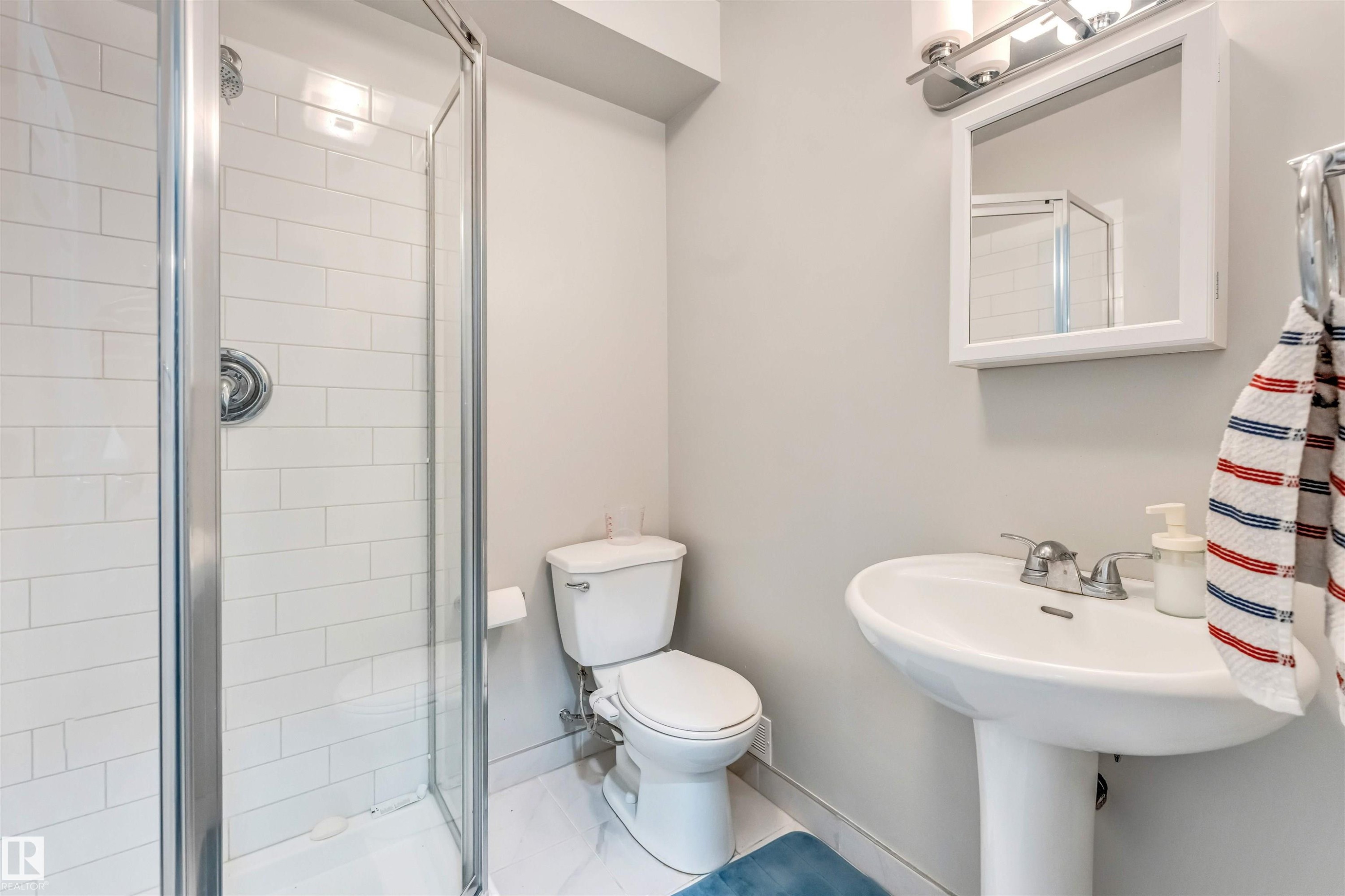Full bathroom featuring a shower stall and toilet - 3478 Weidle Way, Edmonton, AB - Indoor Photo Showing Bathroom