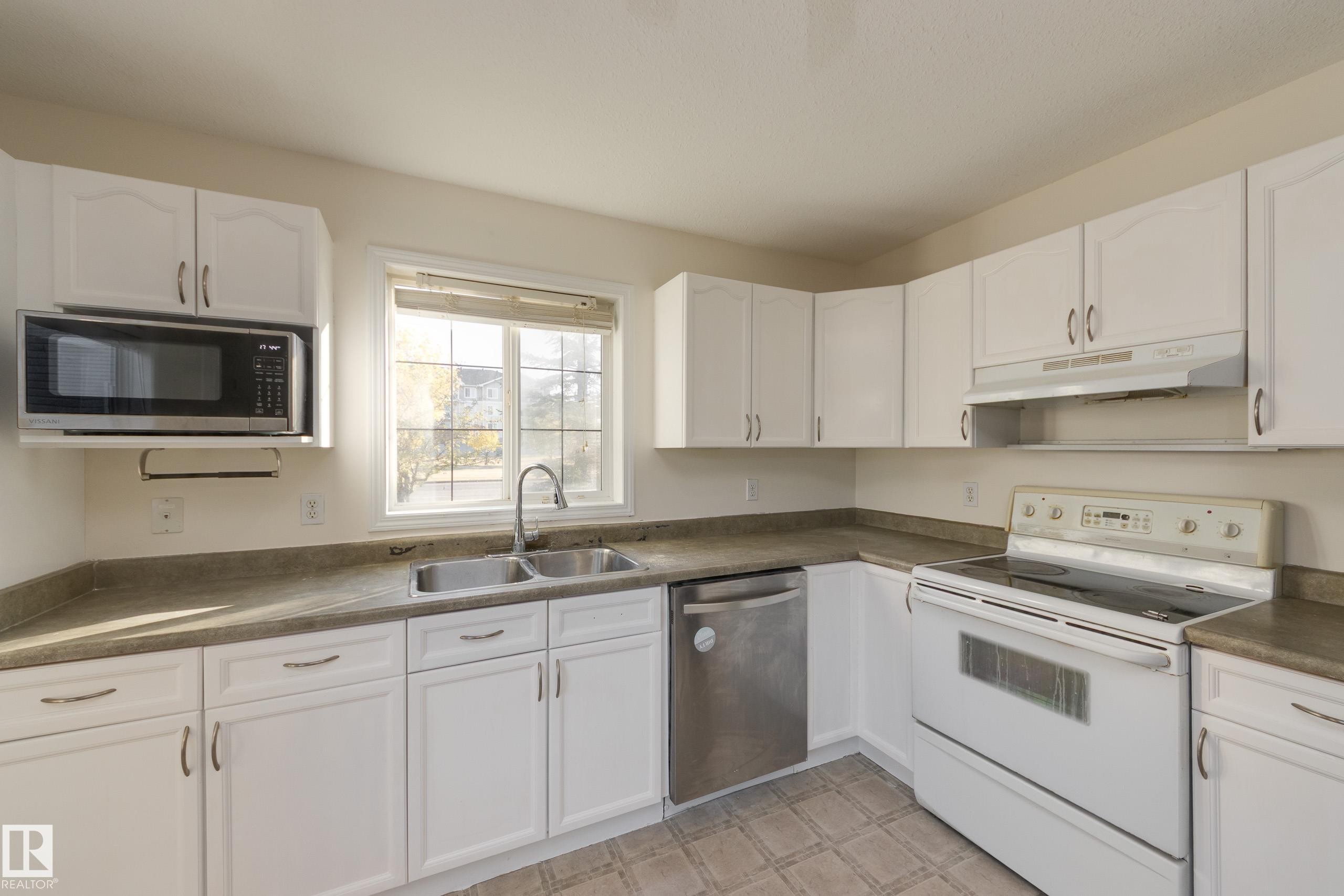 Edmonton, AB - Indoor Photo Showing Kitchen With Double Sink