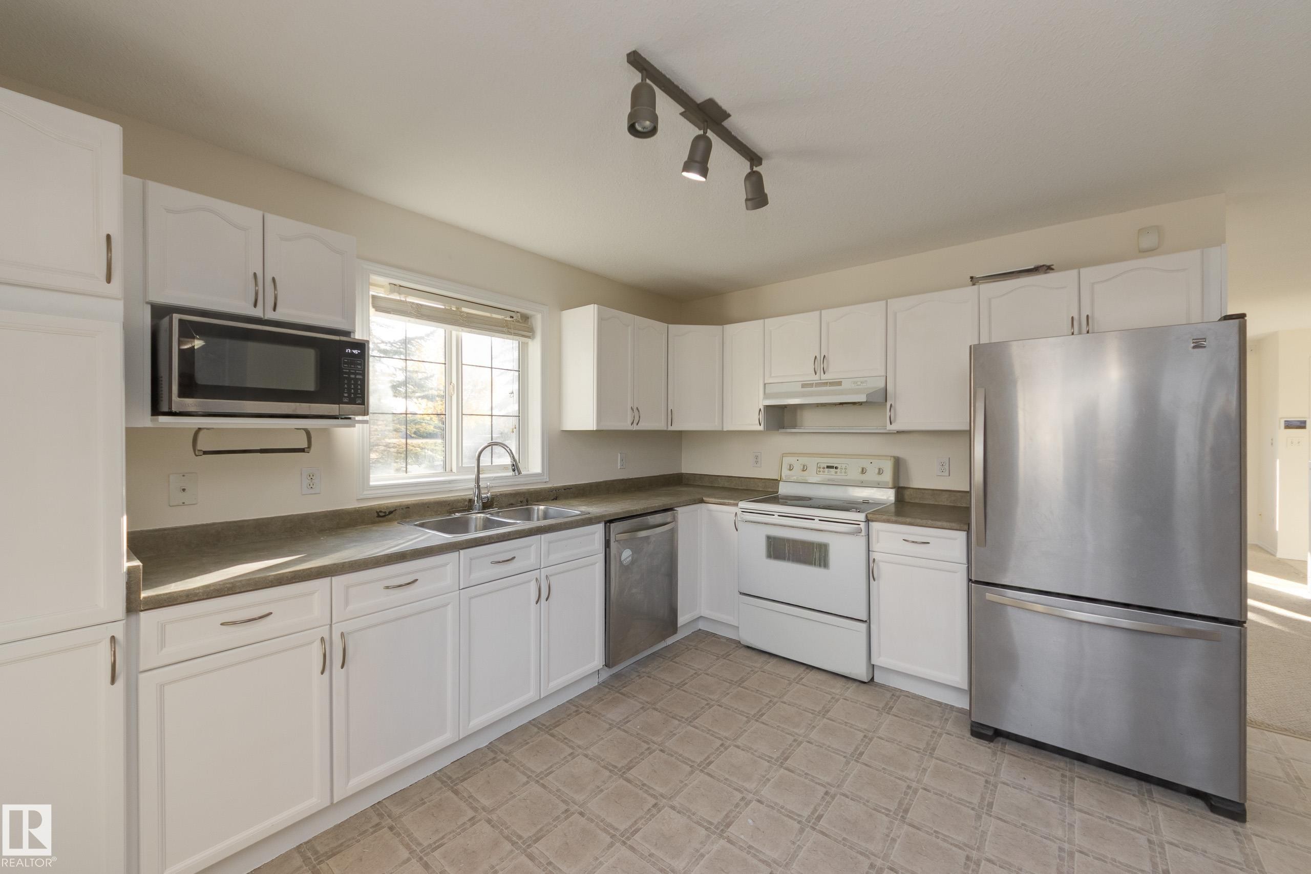 Edmonton, AB - Indoor Photo Showing Kitchen With Double Sink