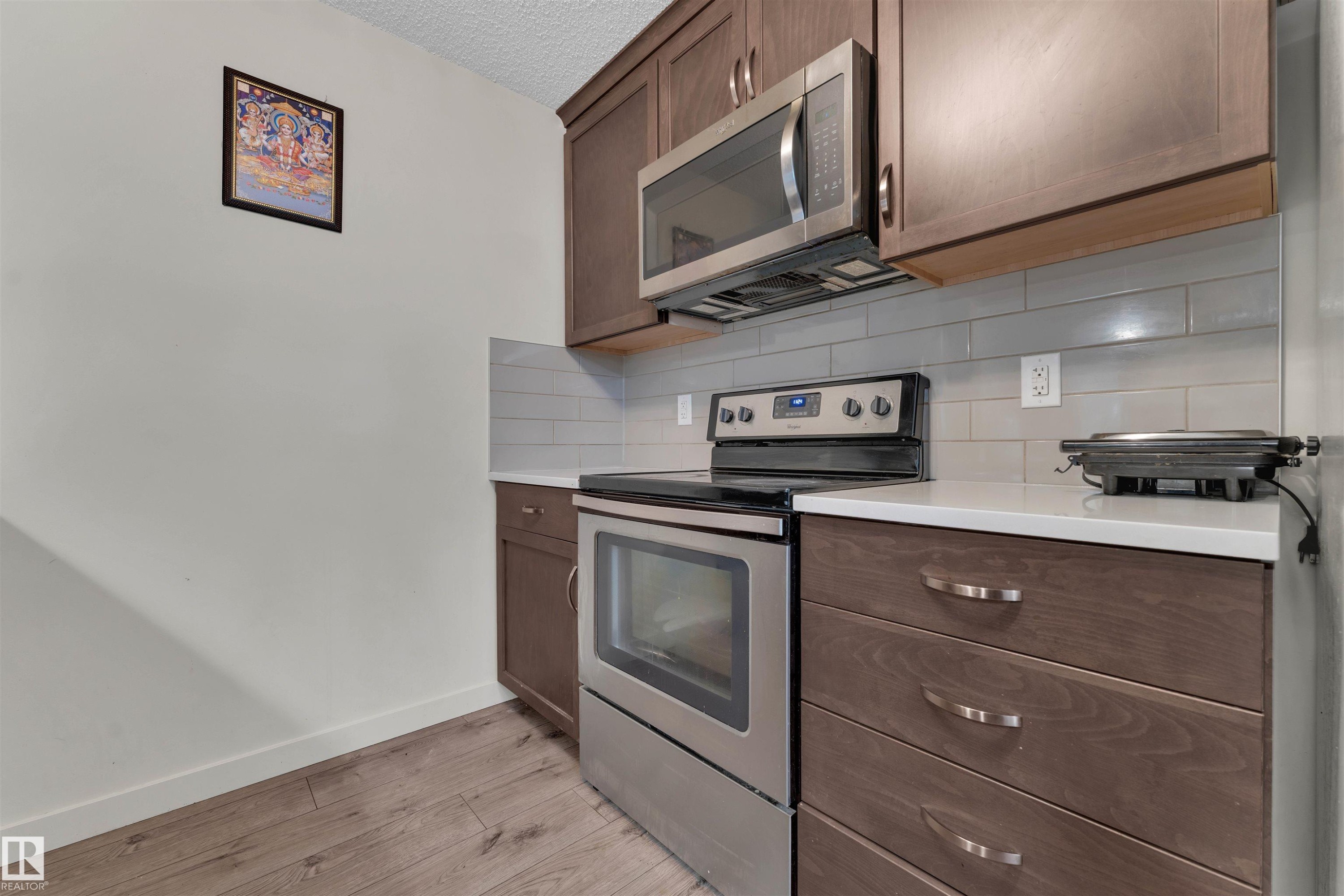 106 4008 Savaryn Drive, Edmonton, AB - Indoor Photo Showing Kitchen With Stainless Steel Kitchen