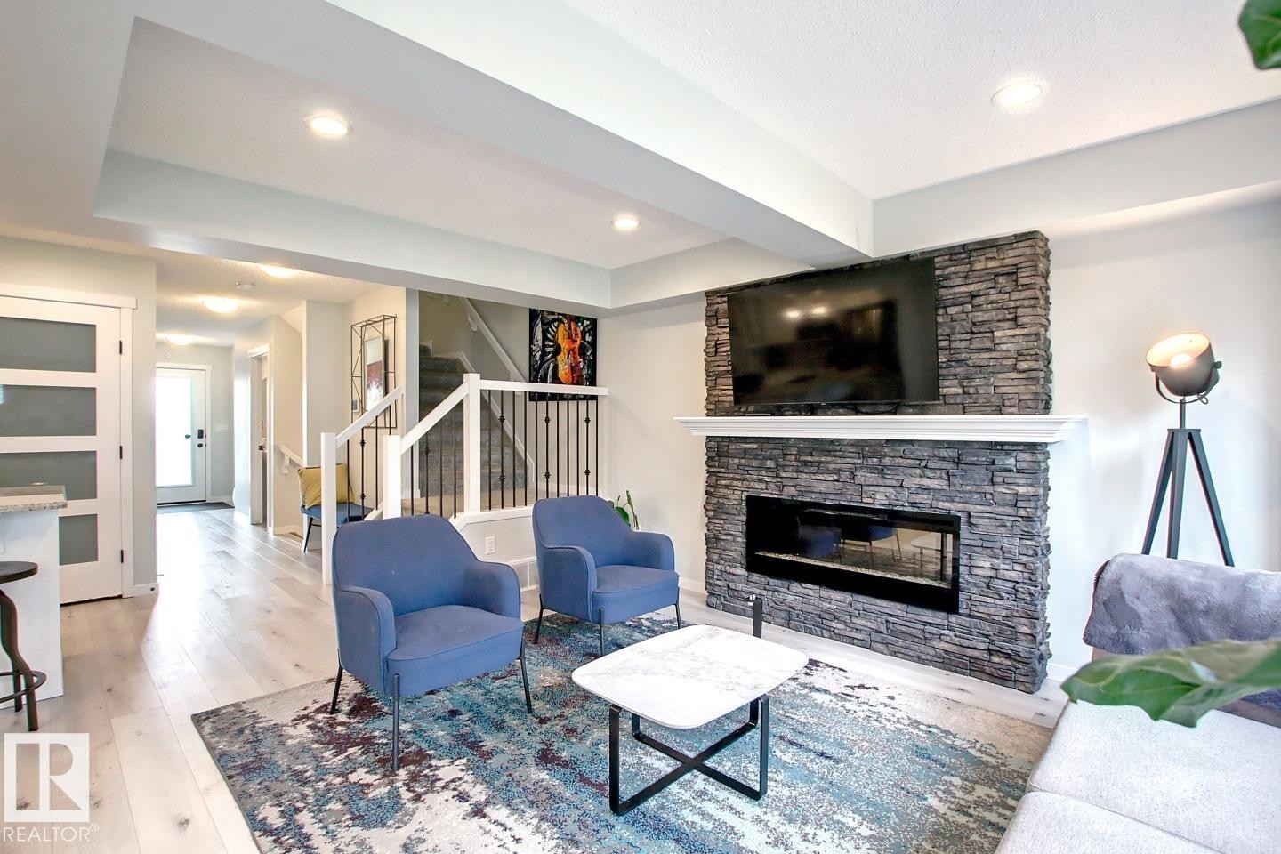 19633 26A Av, Edmonton, AB - Indoor Photo Showing Living Room With Fireplace