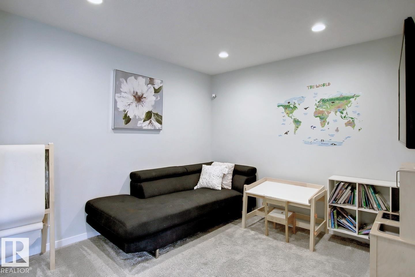 Sitting room with light colored carpet and recessed lighting - 19633 26A Av, Edmonton, AB - Indoor
