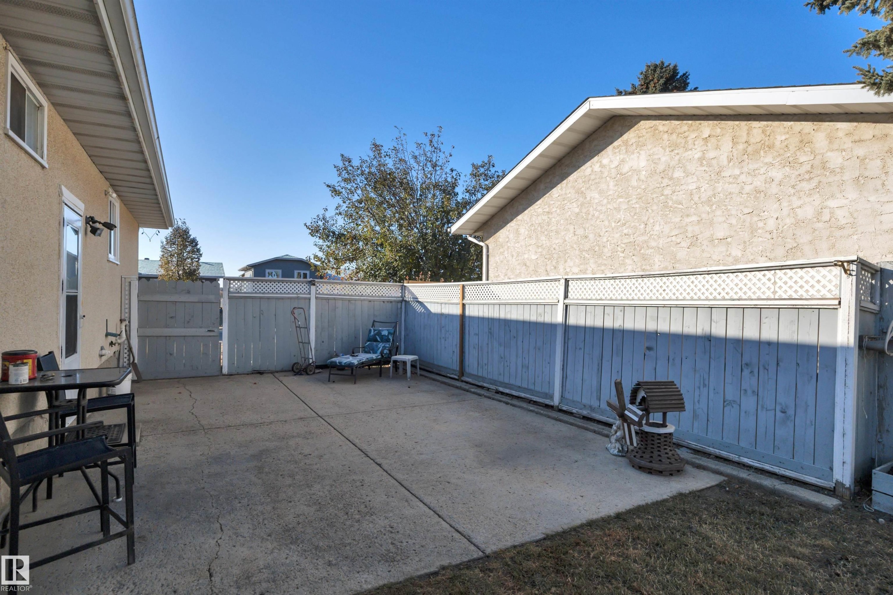 Fenced backyard with a patio - 5312 36 Ave, Wetaskiwin, AB - Outdoor With Exterior