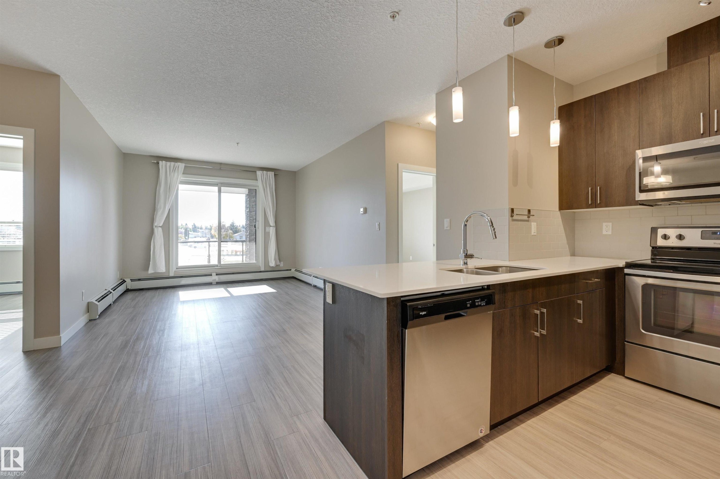 205 17 Columbia Avenue, Devon, AB - Indoor Photo Showing Kitchen With Stainless Steel Kitchen With Double Sink