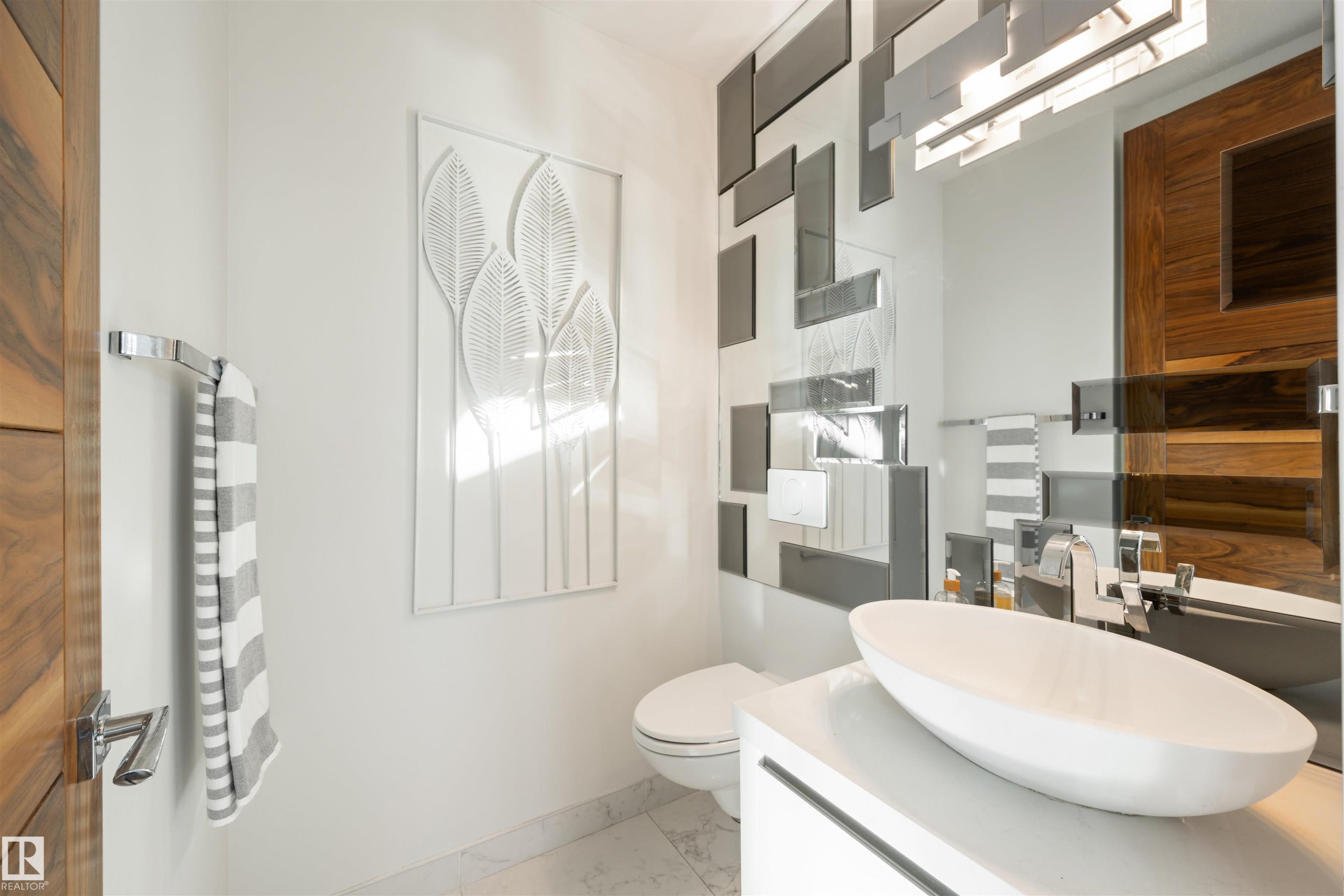 Half bathroom with vanity and marble finish flooring - 3201 11969 Jasper Avenue, Edmonton, AB - Indoor Photo Showing Bathroom