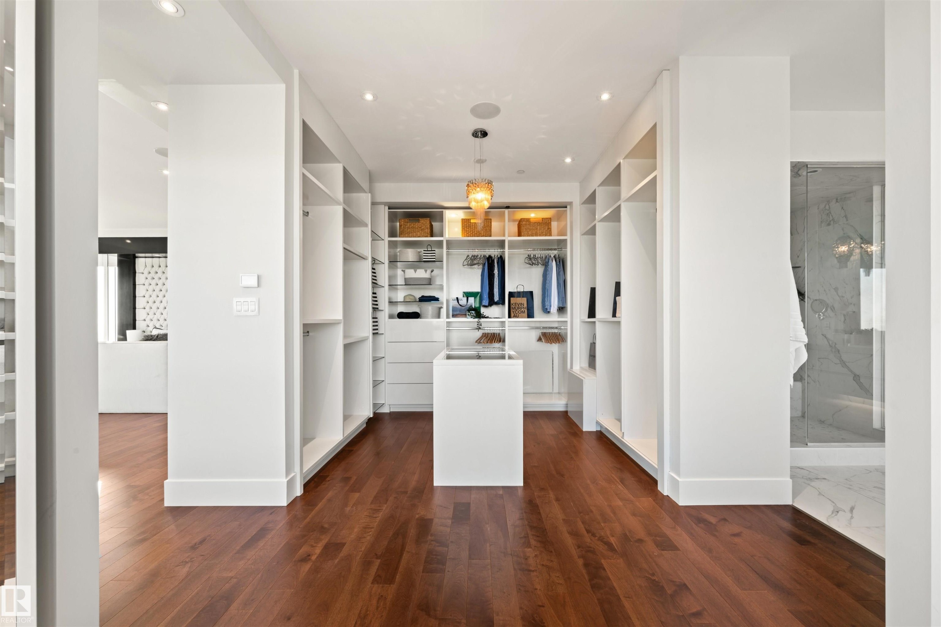 Spacious closet with dark wood-type flooring - 3201 11969 Jasper Avenue, Edmonton, AB - Indoor