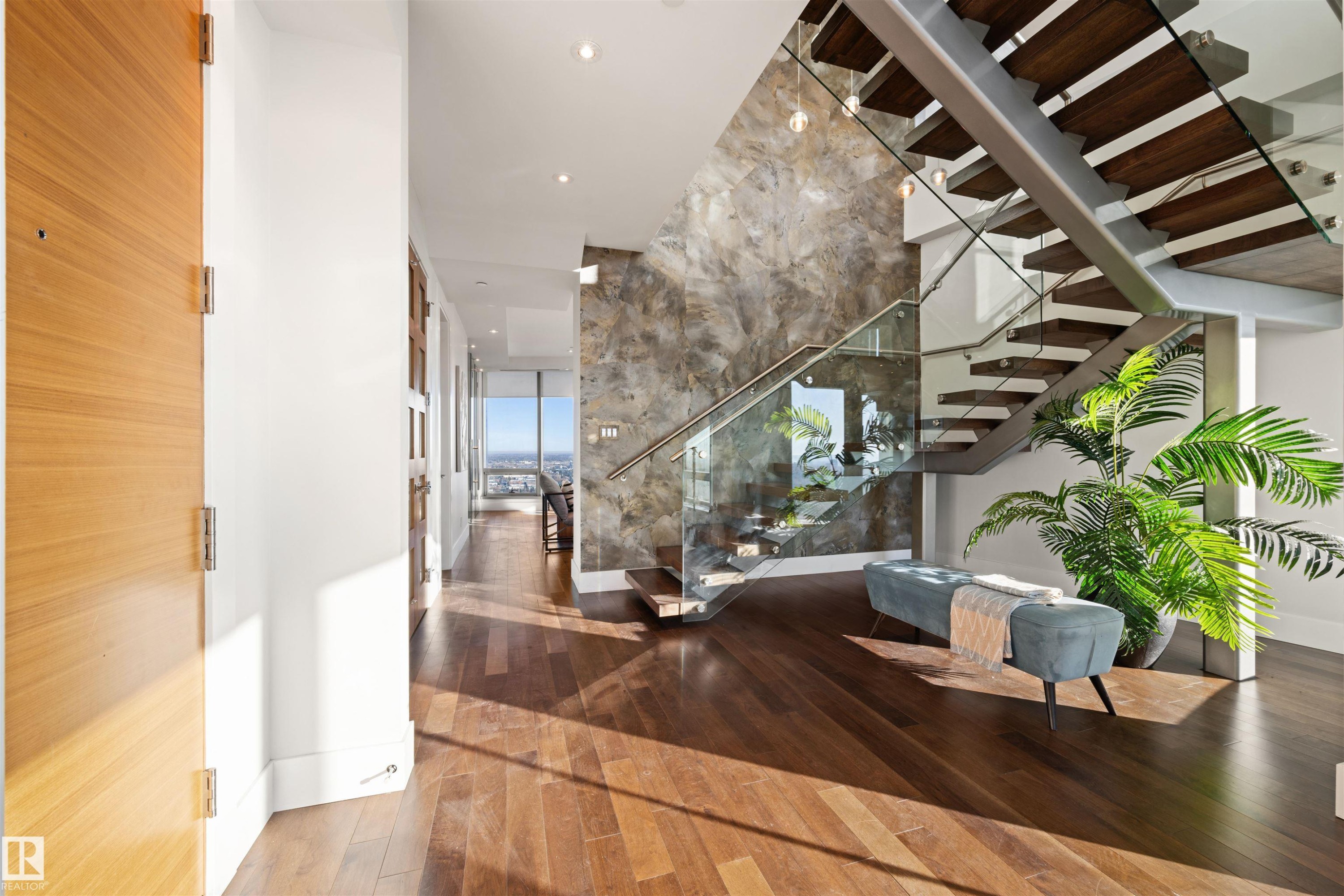 Entrance foyer featuring wood-type flooring, stairway, and recessed lighting - 3201 11969 Jasper Avenue, Edmonton, AB - Indoor Photo Showing Other Room