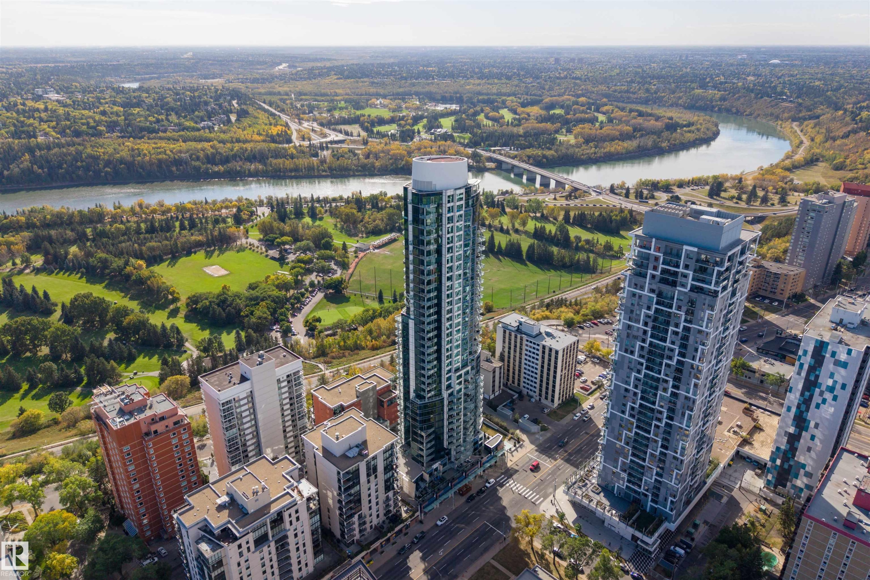 View of urban area featuring a nearby body of water and a notable bridge - 3201 11969 Jasper Avenue, Edmonton, AB - Outdoor With View