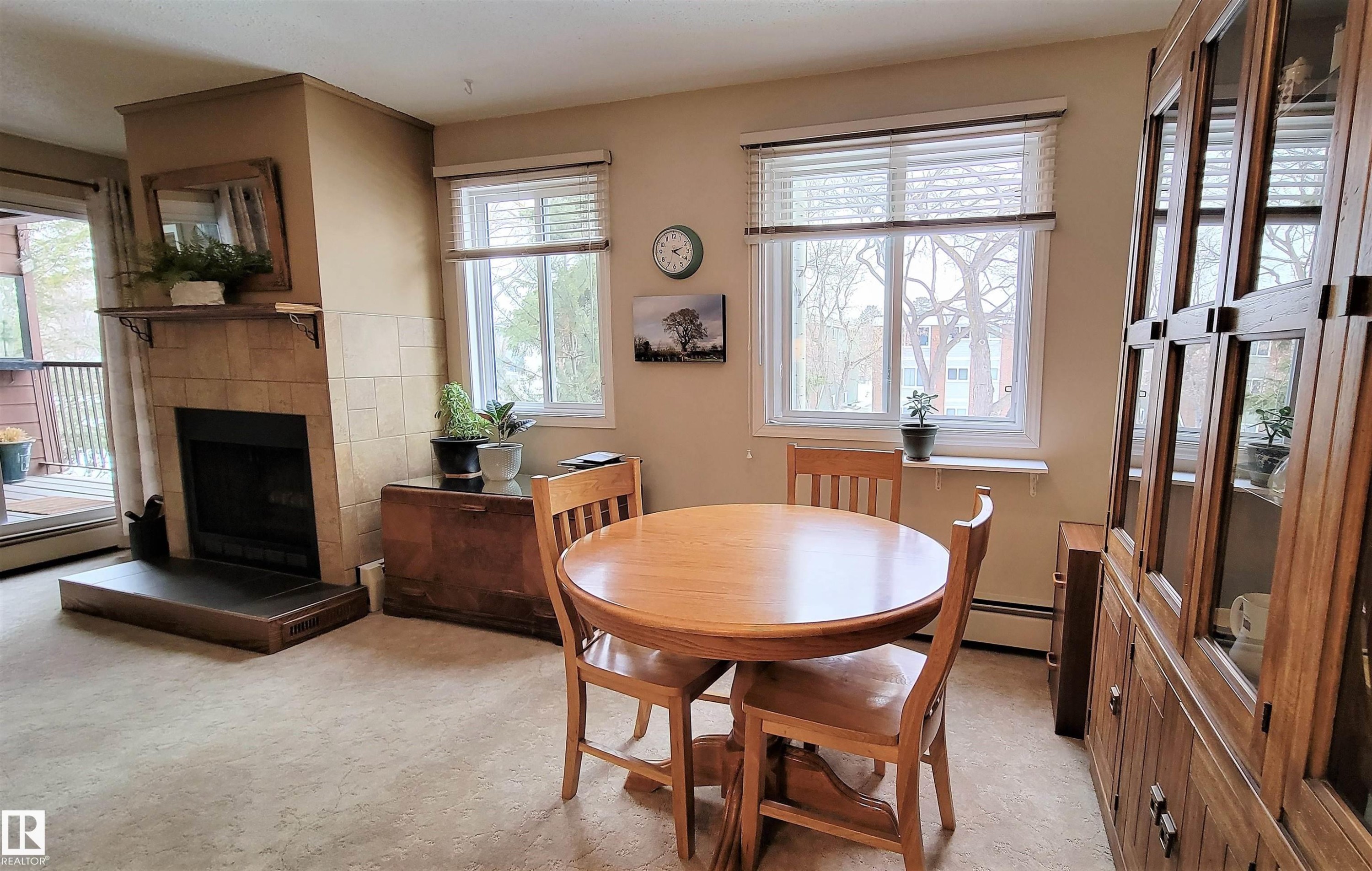 206 10826 113 Street, Edmonton, AB - Indoor Photo Showing Dining Room With Fireplace