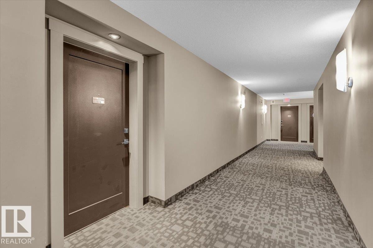 Hall with a textured ceiling and tile patterned floors - 305 5029 Edgemont Boulevard, Edmonton, AB - Indoor Photo Showing Other Room