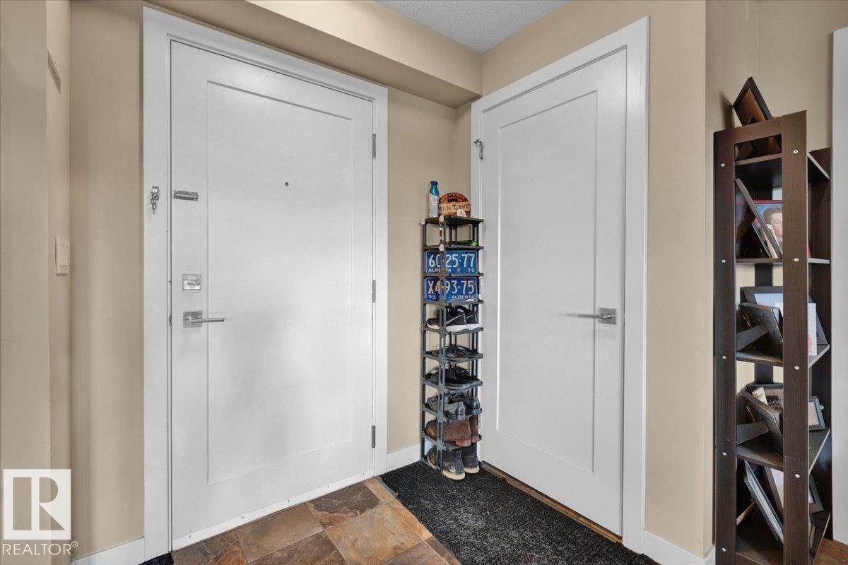 Foyer with baseboards - 305 5029 Edgemont Boulevard, Edmonton, AB - Indoor Photo Showing Other Room