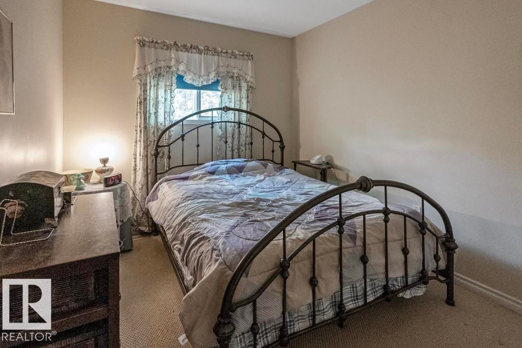 Main floor bedroom - 218 58532 Range Road 113, Rural St. Paul County, AB - Indoor Photo Showing Bedroom