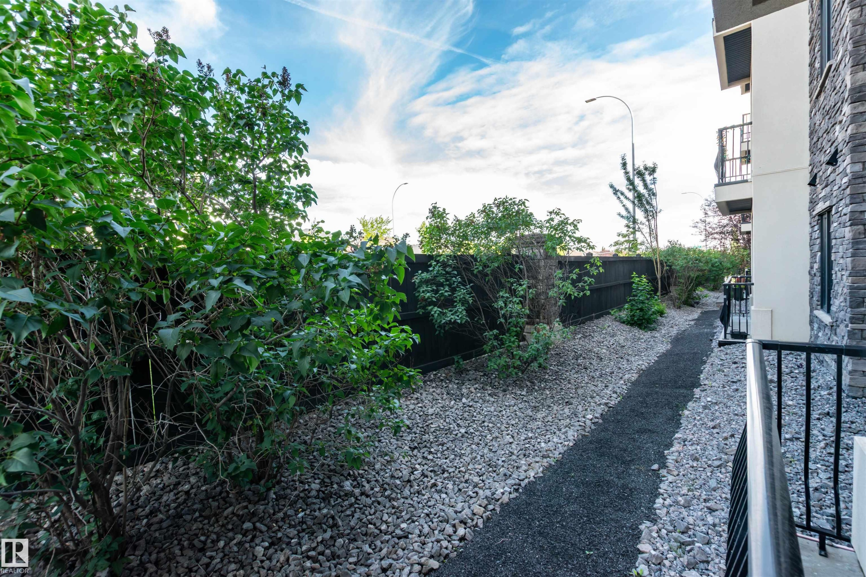 View of yard with a balcony - 140 6079 Maynard Way, Edmonton, AB - Outdoor