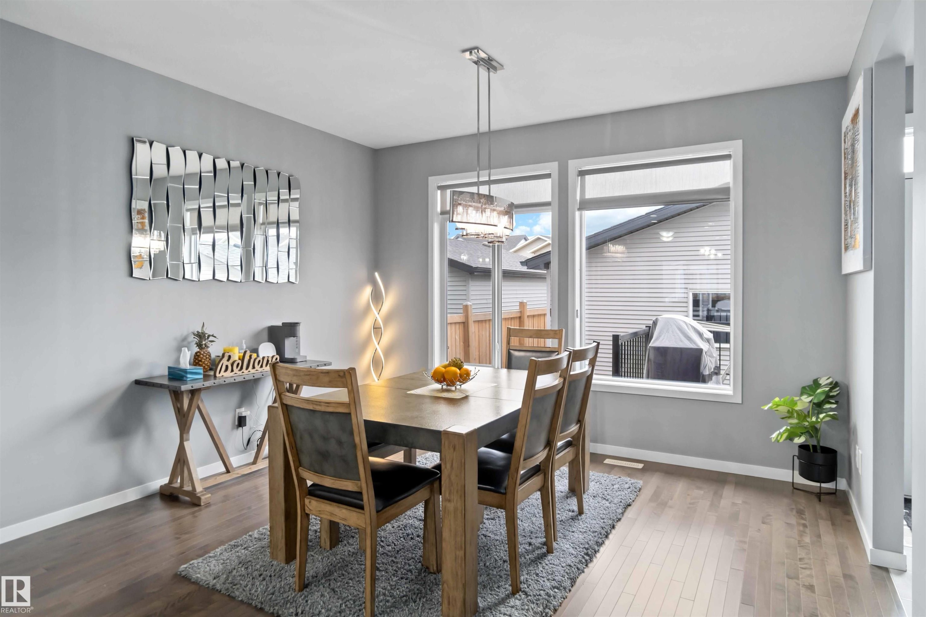 Dining space featuring wood finished floors - 17816 59 Street, Edmonton, AB