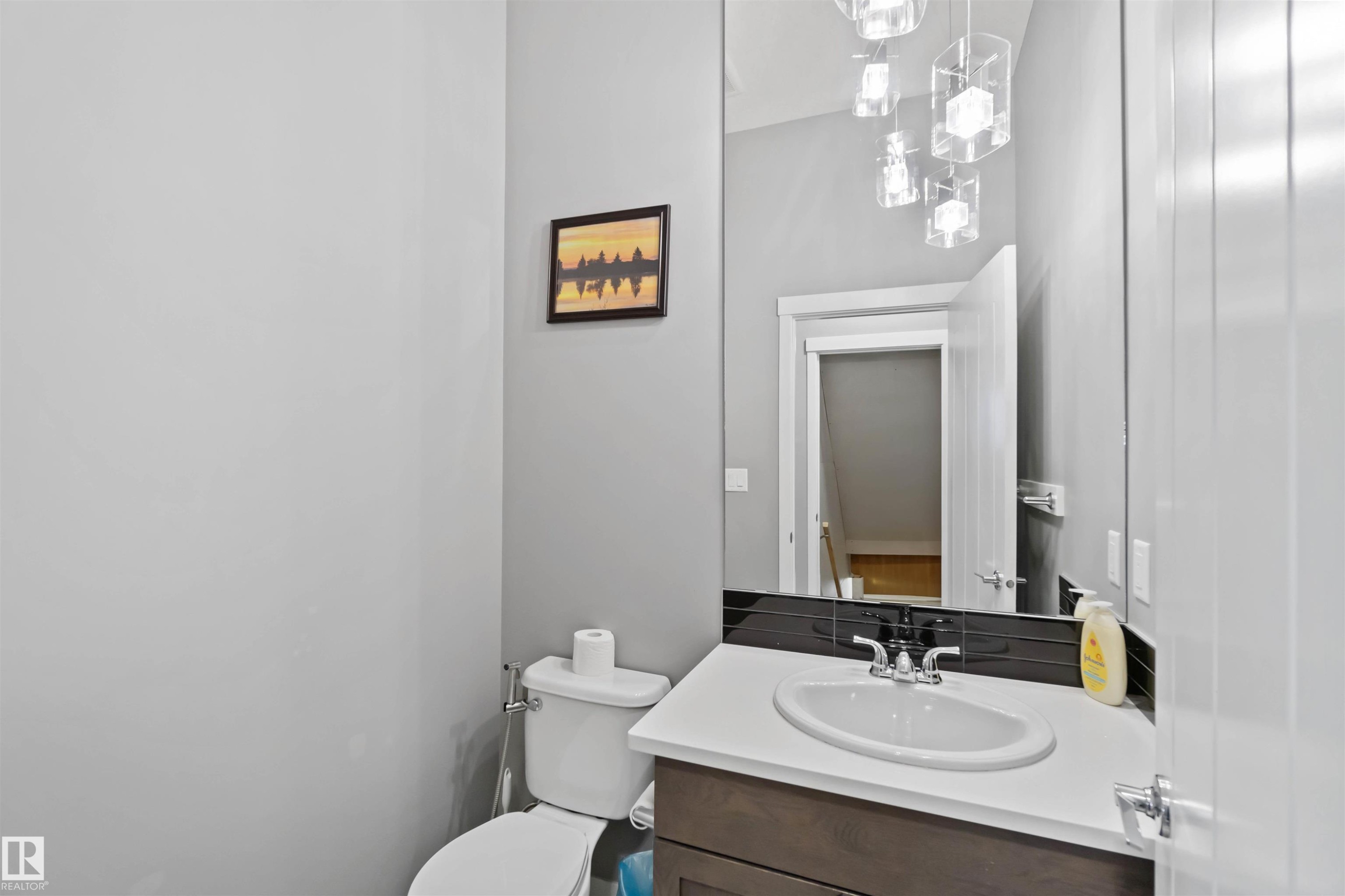 Bathroom featuring vanity and toilet - 17816 59 Street, Edmonton, AB