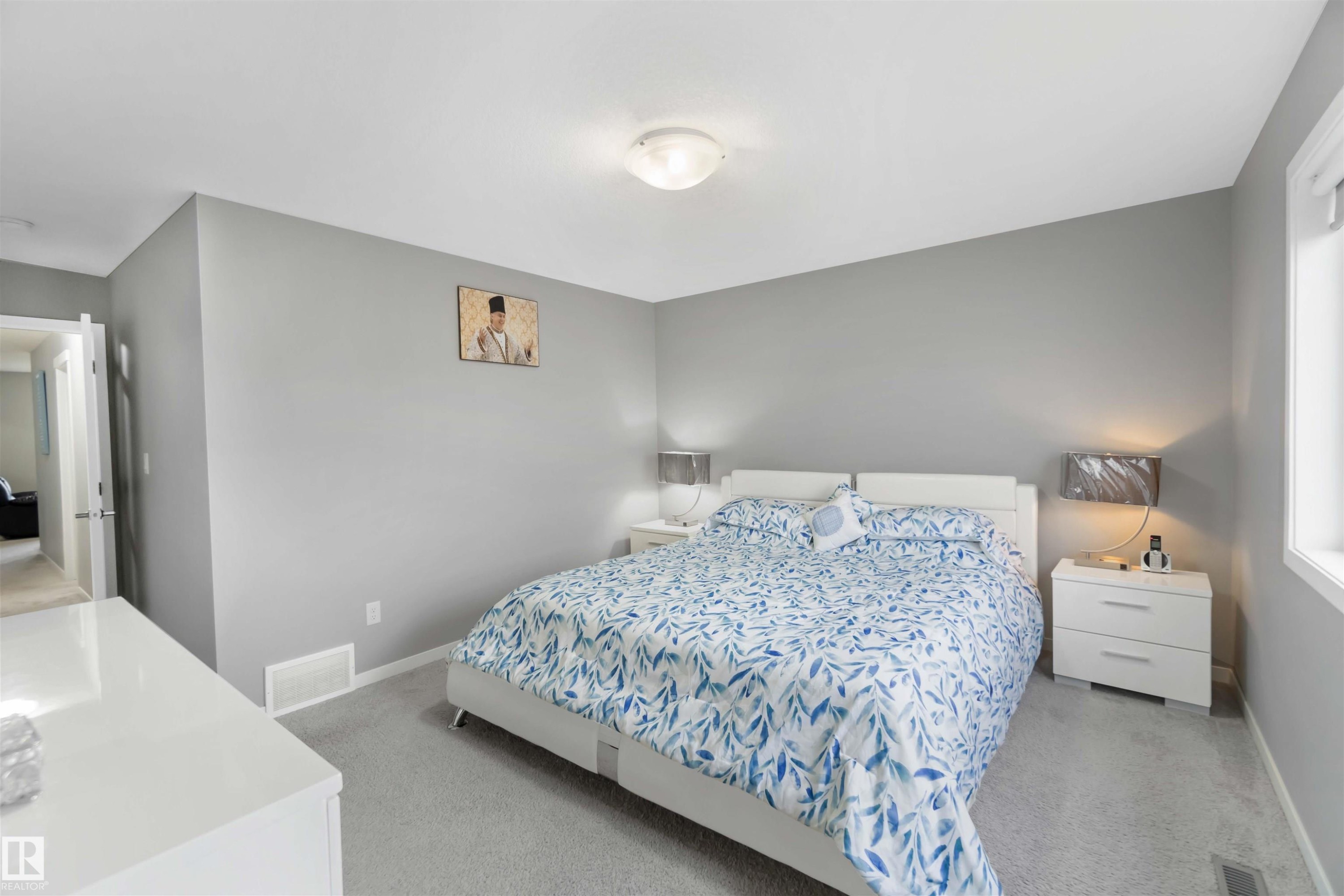 Bedroom featuring light colored carpet and baseboards - 17816 59 Street, Edmonton, AB