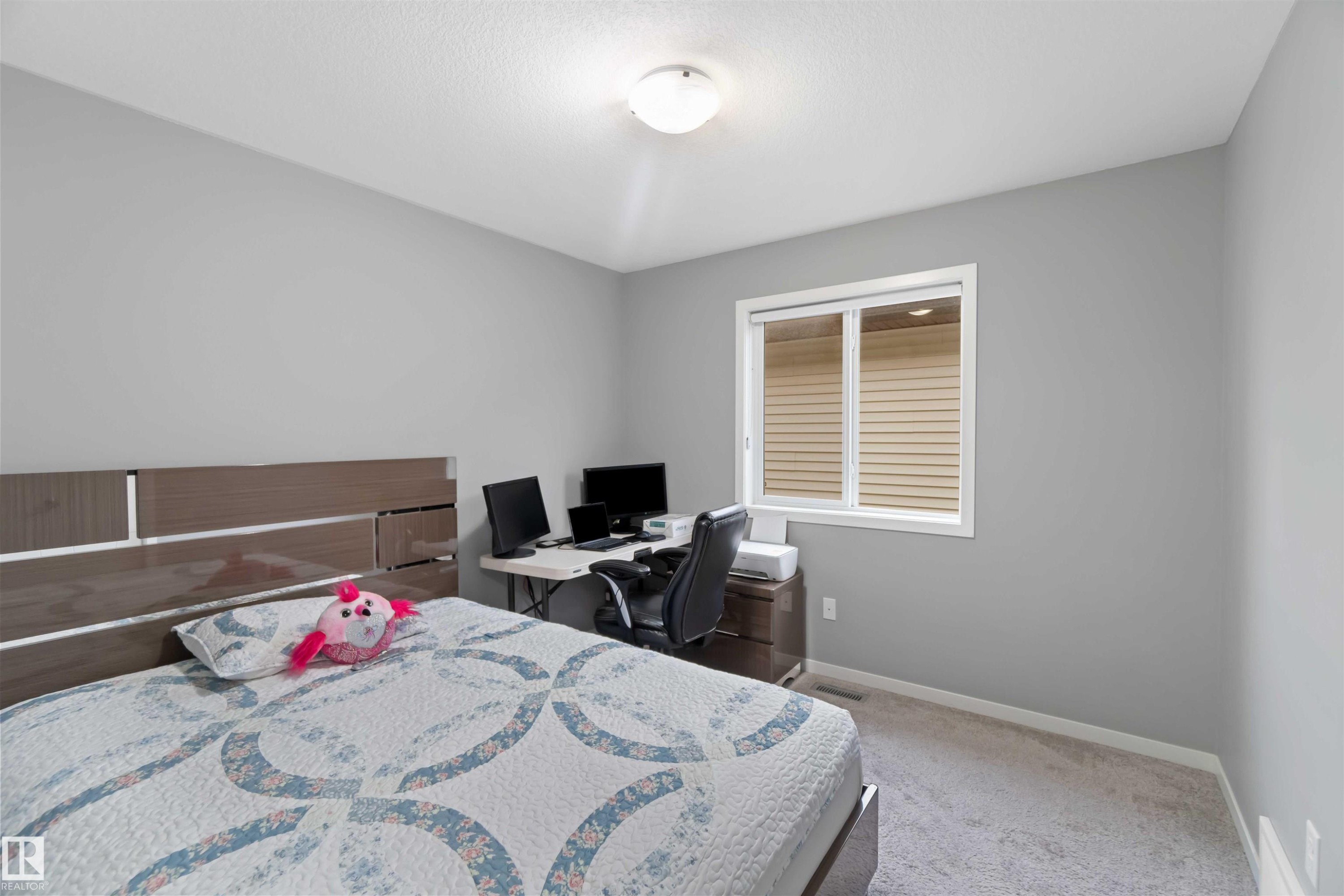 Bedroom with carpet flooring and a desk - 17816 59 Street, Edmonton, AB