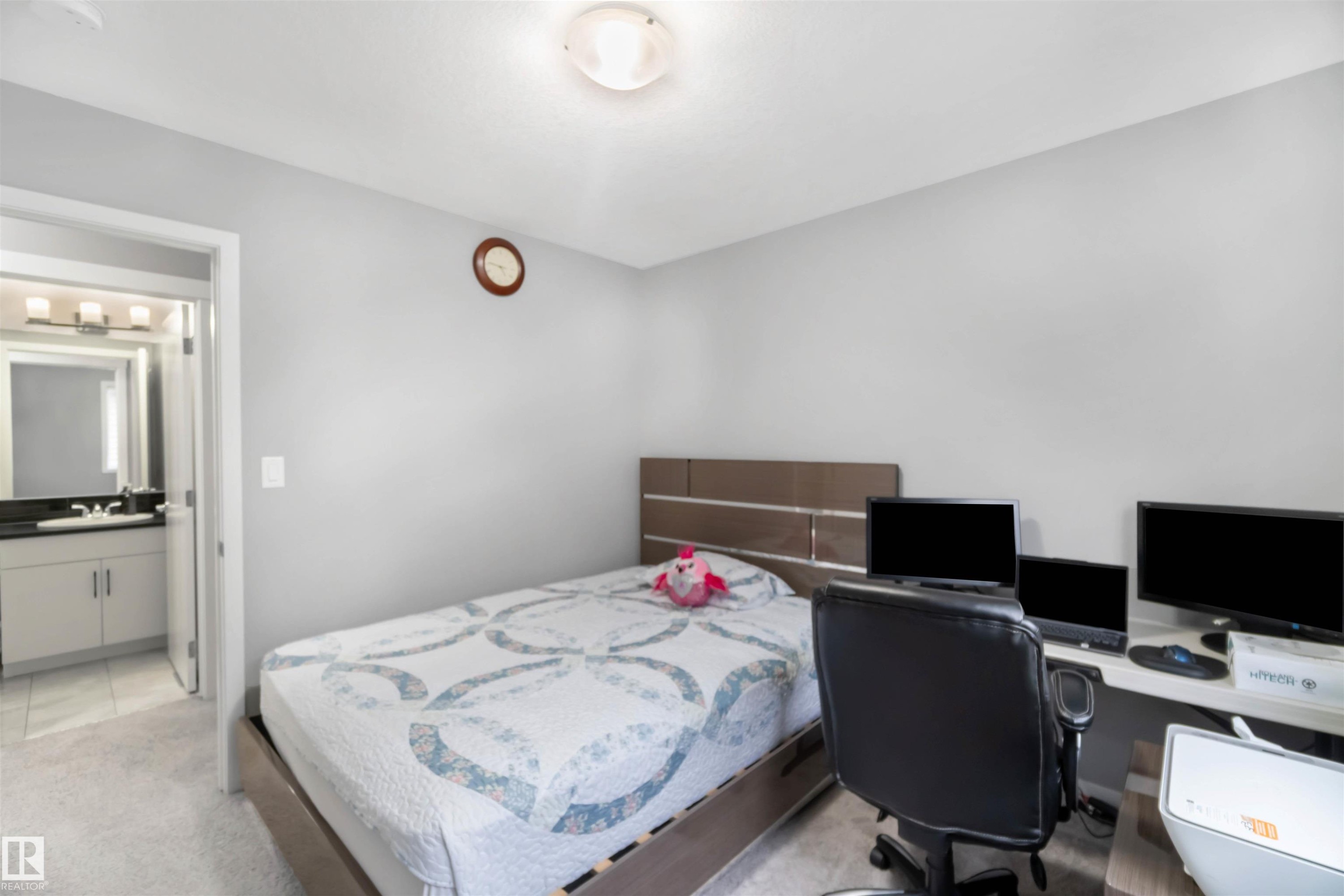 Bedroom with light carpet and an office area - 17816 59 Street, Edmonton, AB