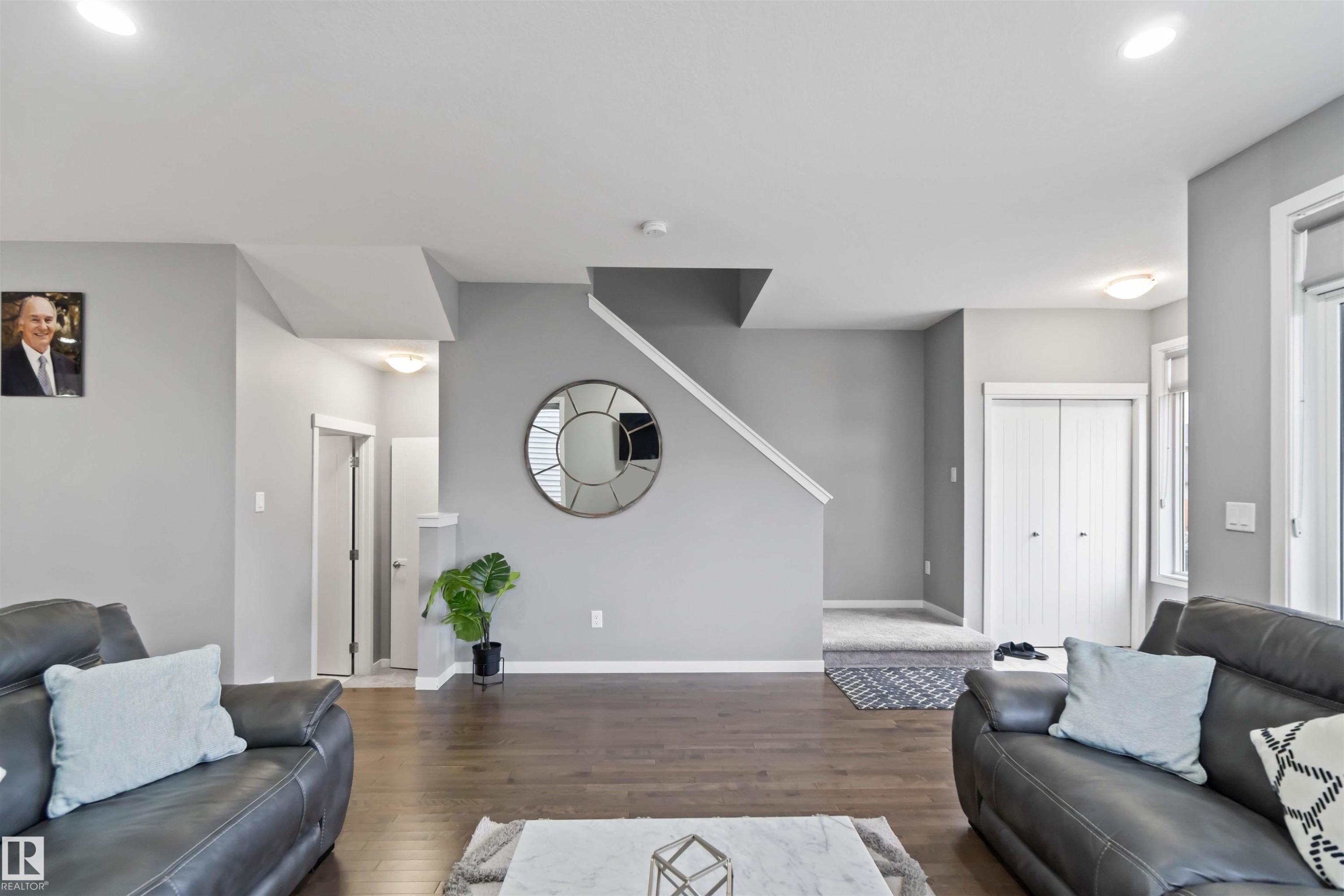 Living room featuring wood finished floors and recessed lighting - 17816 59 Street, Edmonton, AB