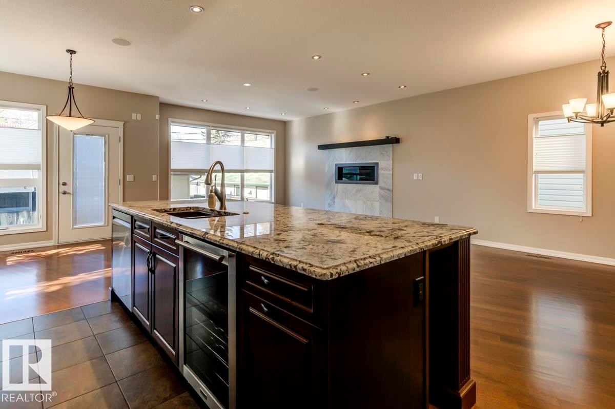 11122 52 Street, Edmonton, AB - Indoor Photo Showing Kitchen With Fireplace With Upgraded Kitchen