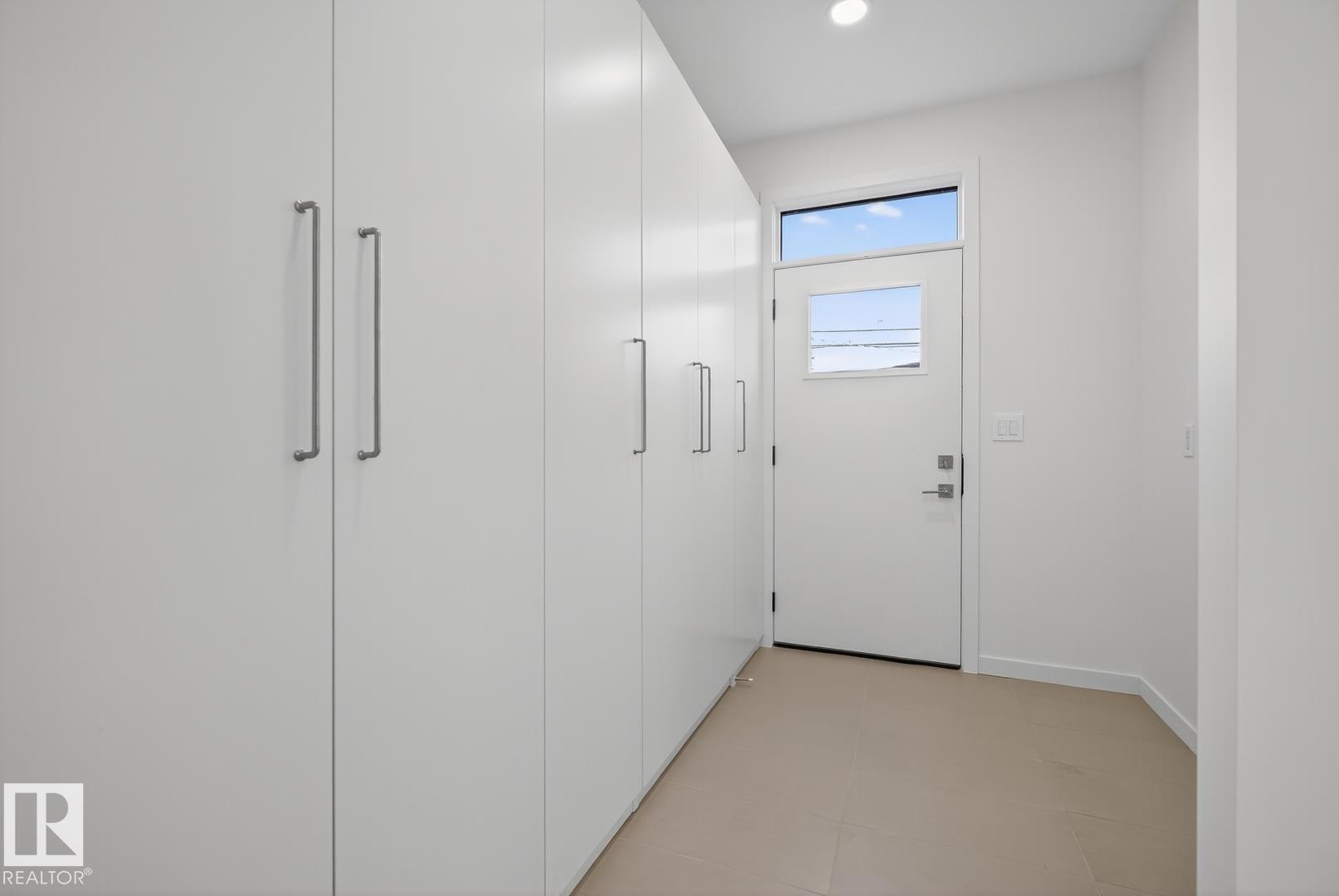 TONS of storage at the rear door. There is also a large pantry. - 14502 103 Avenue, Edmonton, AB - Indoor Photo Showing Other Room