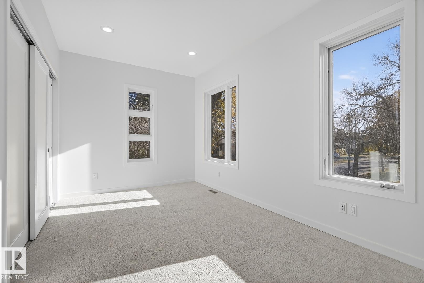 Unfurnished bedroom with carpet flooring, recessed lighting, and a closet - 14502 103 Avenue, Edmonton, AB - Indoor Photo Showing Other Room
