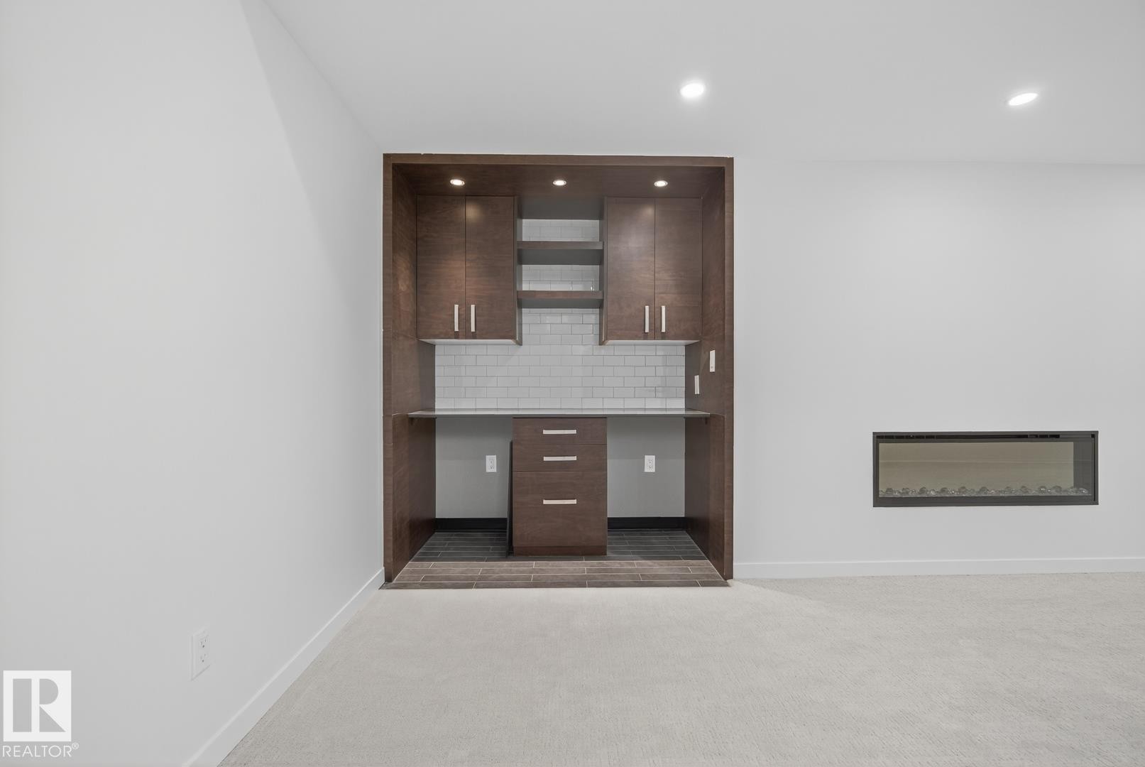 Bar featuring dark brown cabinets, tasteful backsplash, light colored carpet, recessed lighting, and light countertops - 14502 103 Avenue, Edmonton, AB - Indoor Photo Showing Other Room