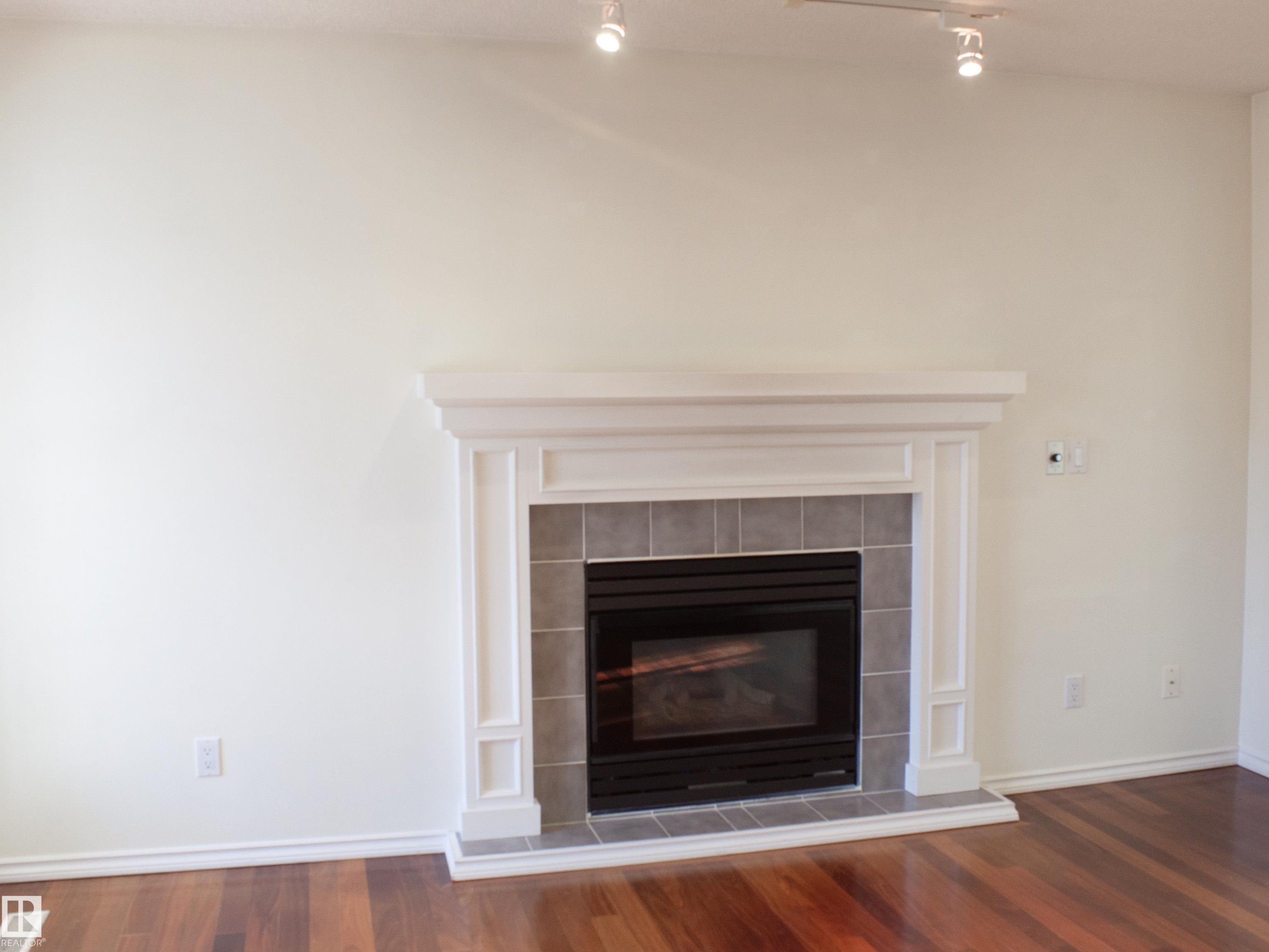 9130 77 Avenue, Edmonton, AB - Indoor Photo Showing Living Room With Fireplace