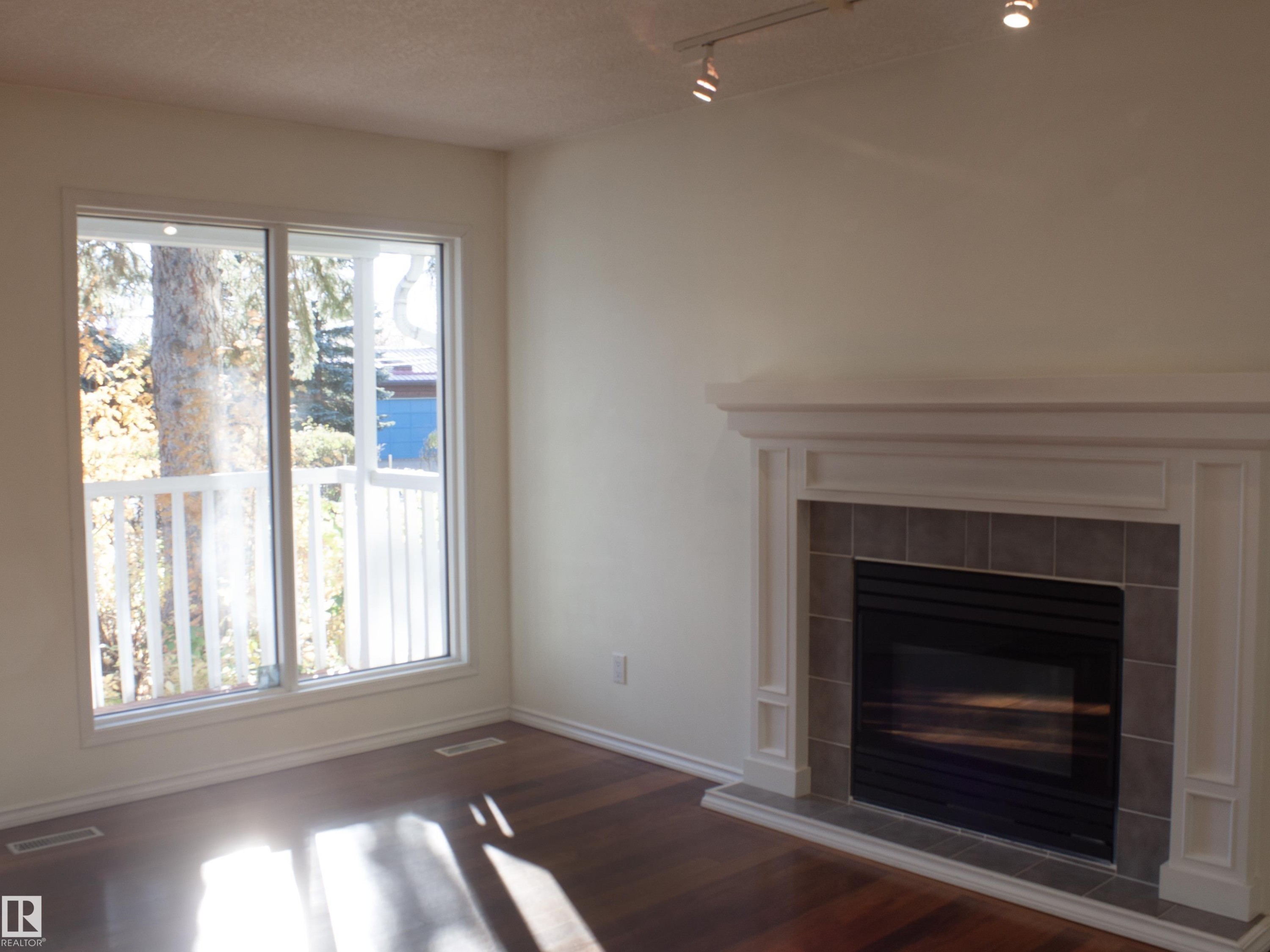 9130 77 Avenue, Edmonton, AB - Indoor Photo Showing Living Room With Fireplace
