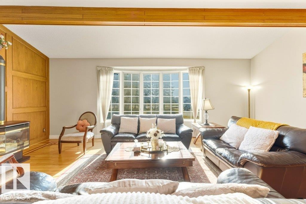 7550 Ellerslie Road, Edmonton, AB - Indoor Photo Showing Living Room With Fireplace