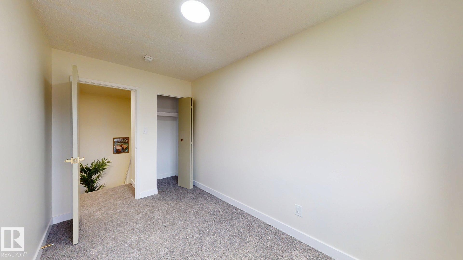 Unfurnished bedroom featuring carpet and a closet - 114 2908 116A Avenue, Edmonton, AB - Indoor Photo Showing Other Room