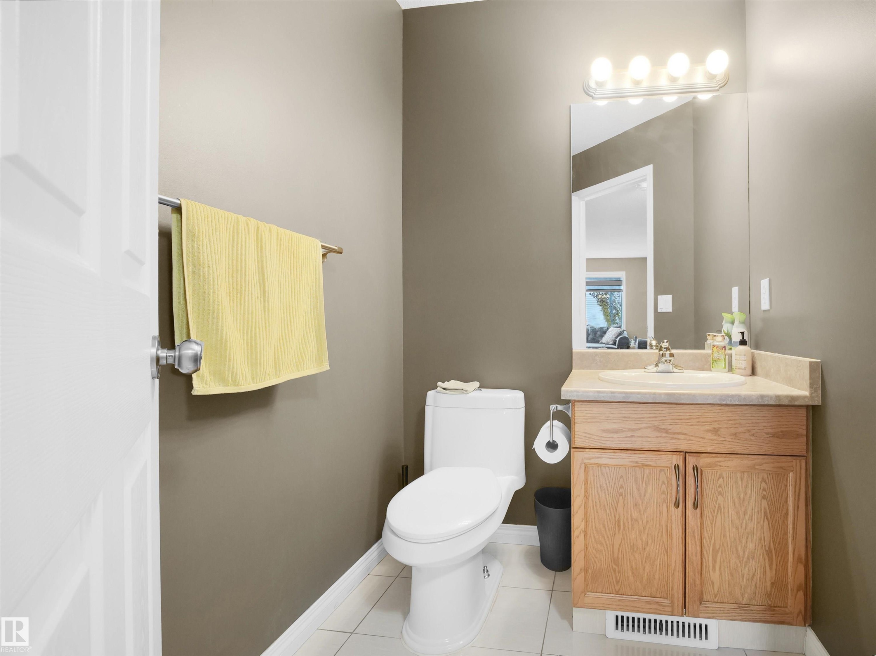 Bathroom featuring vanity and light tile patterned floors - 94 Dechene Road, Edmonton, AB - Indoor Photo Showing Bathroom
