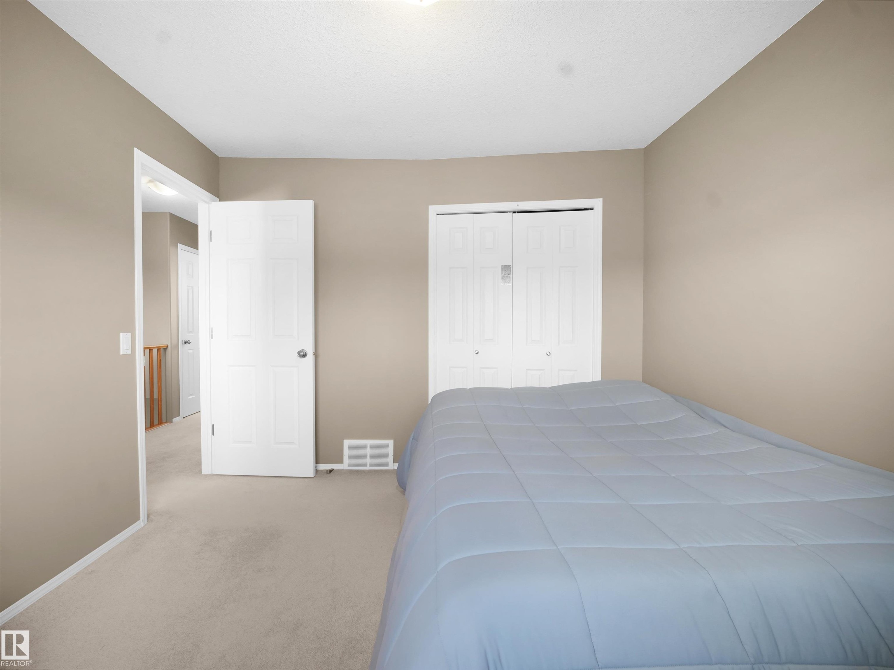 Bedroom with carpet flooring and a closet - 94 Dechene Road, Edmonton, AB - Indoor Photo Showing Bedroom