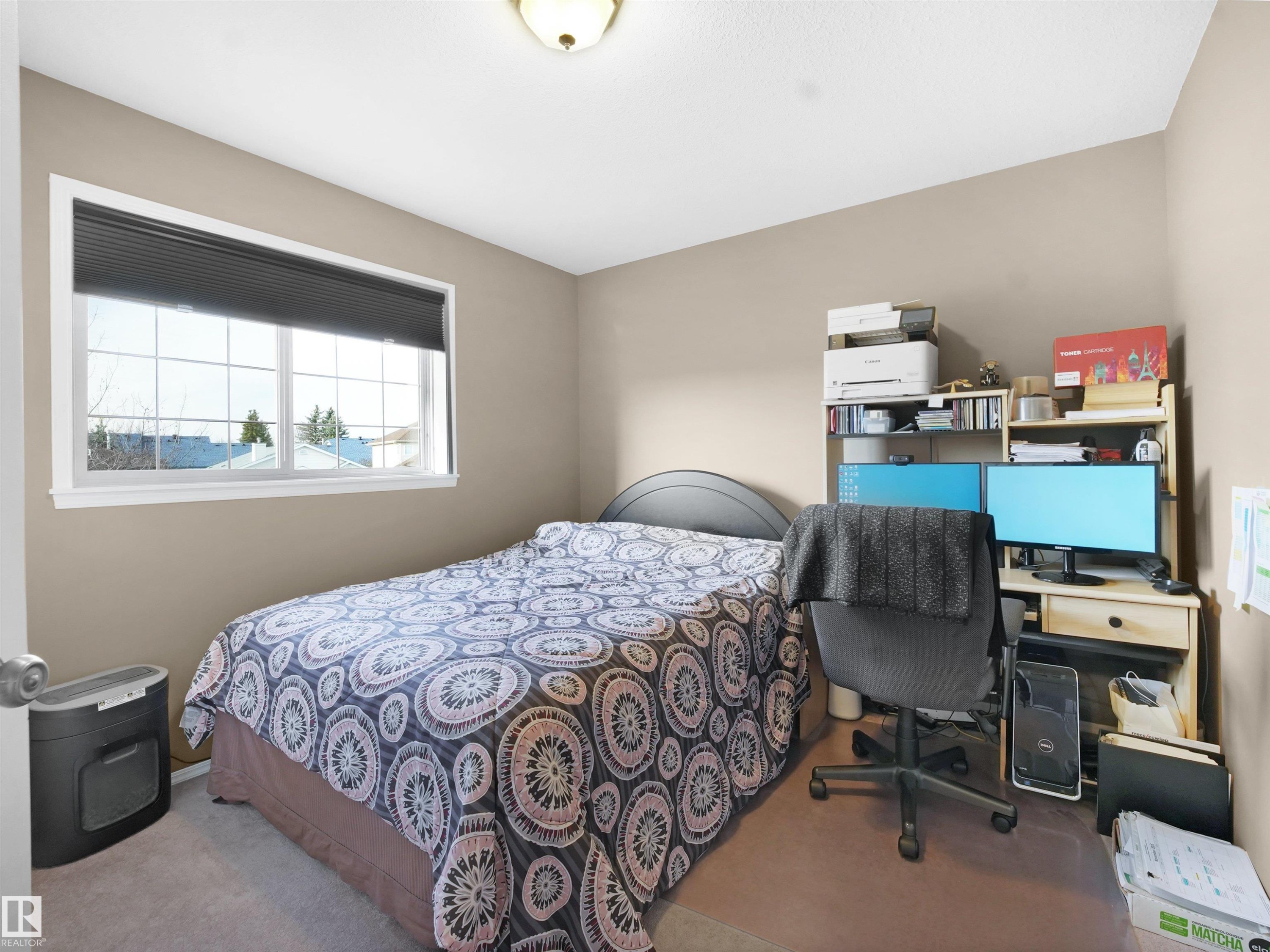 Bedroom featuring carpet and a desk - 94 Dechene Road, Edmonton, AB - Indoor Photo Showing Bedroom