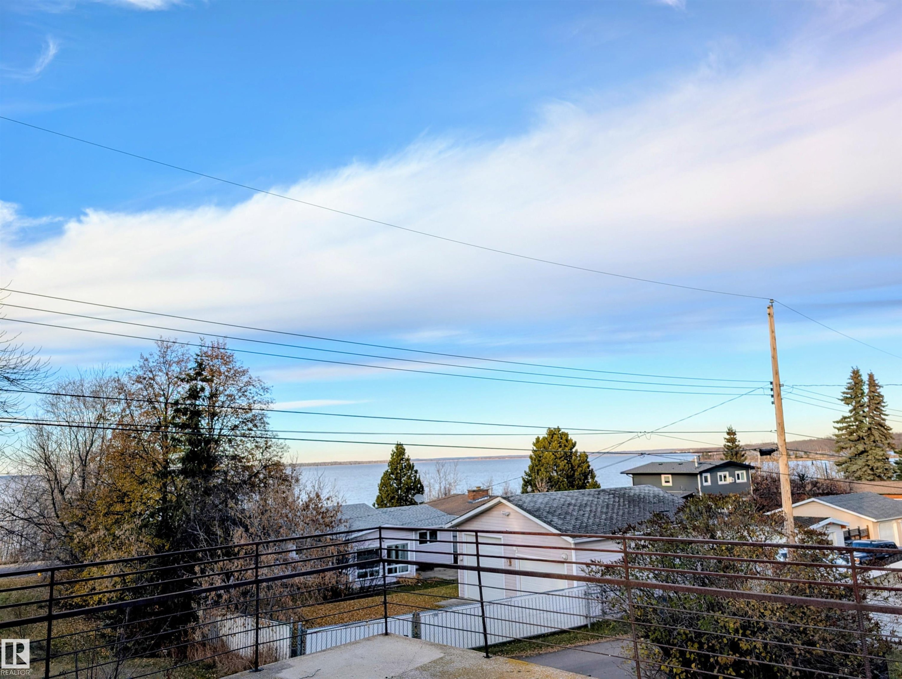 View of deck - 10014 103 Ave, Lac La Biche, AB - Outdoor With Body Of Water With View
