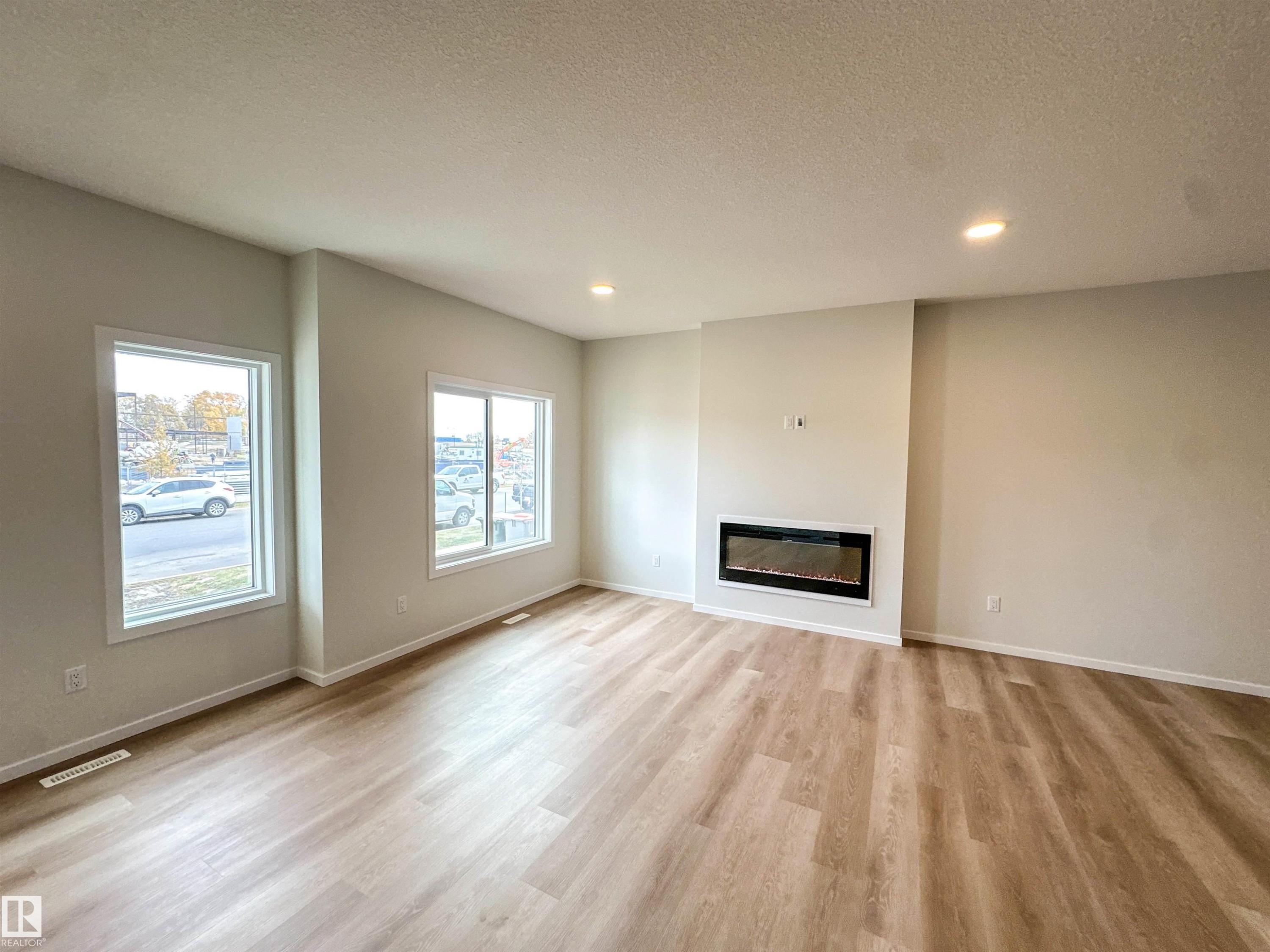 107 Brickyard Drive, Stony Plain, AB - Indoor Photo Showing Living Room With Fireplace