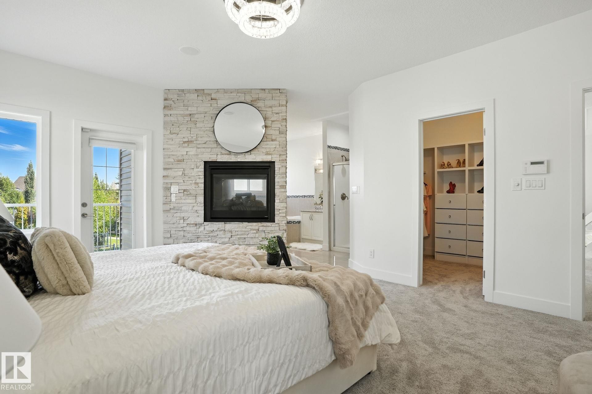 971 Summerside Link, Edmonton, AB - Indoor Photo Showing Bedroom With Fireplace