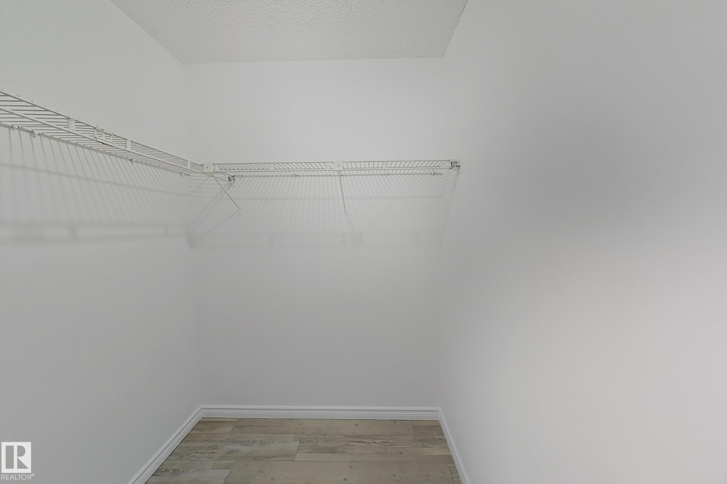 Spacious closet featuring light wood finished floors - 309 1624 48 Street, Edmonton, AB - Indoor With Storage
