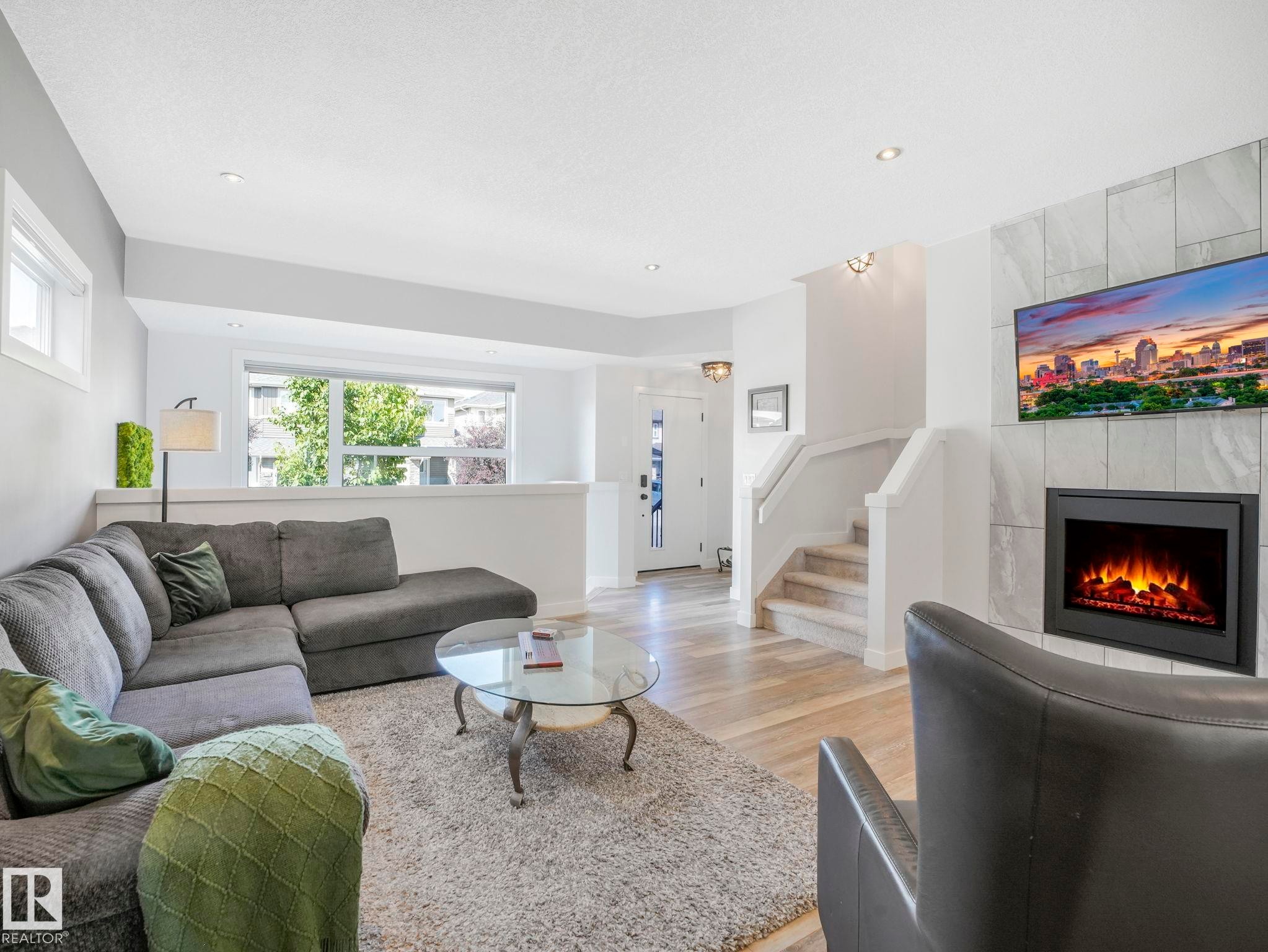 6693 Cardinal Road, Edmonton, AB - Indoor Photo Showing Living Room With Fireplace