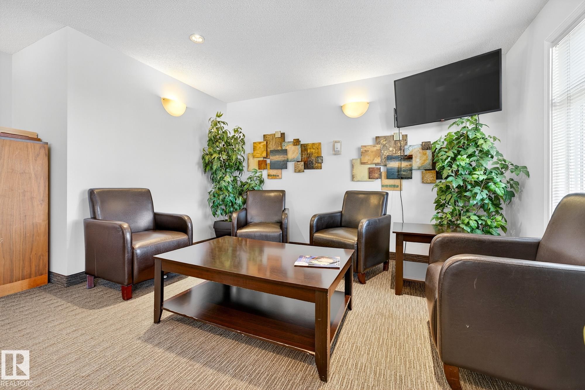 402 6070 Schonsee Way, Edmonton, AB - Indoor Photo Showing Living Room