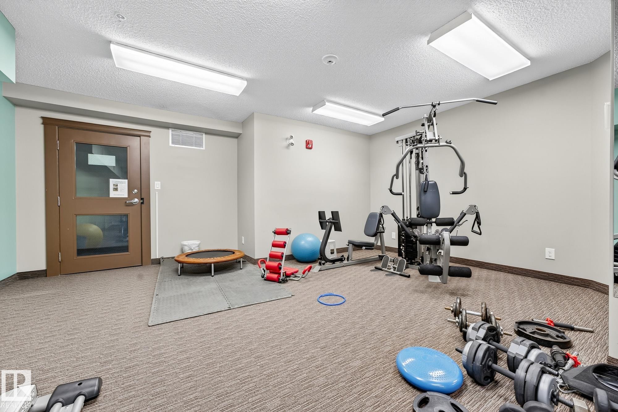 402 6070 Schonsee Way, Edmonton, AB - Indoor Photo Showing Gym Room