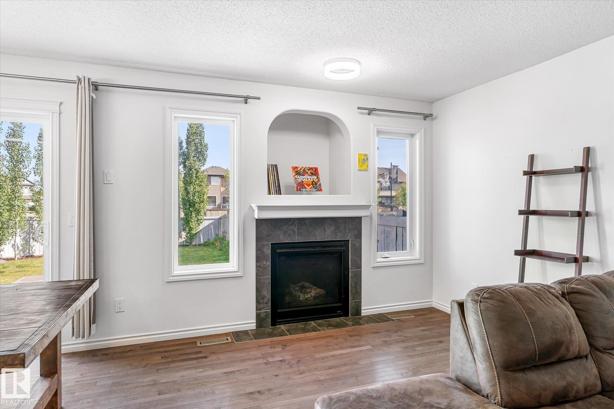 17130 7A Avenue, Edmonton, AB - Indoor Photo Showing Living Room With Fireplace