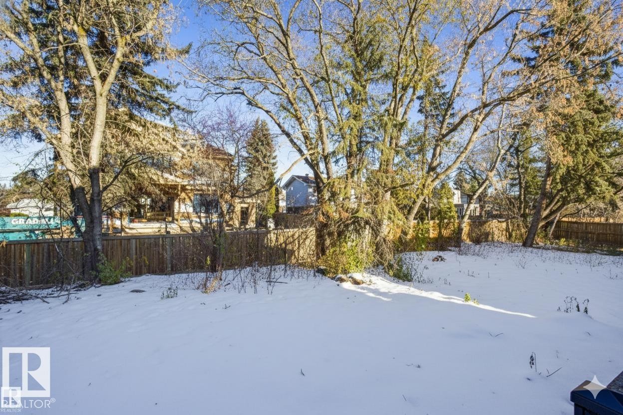 Yard layered in snow with a fenced backyard - 12304 39 Avenue, Edmonton, AB - Outdoor
