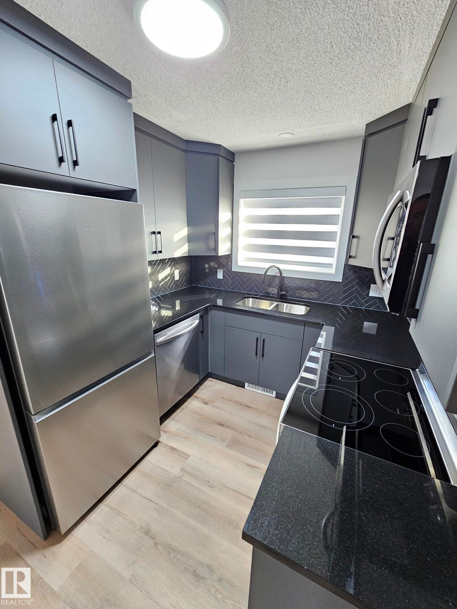 Edmonton, AB - Indoor Photo Showing Kitchen