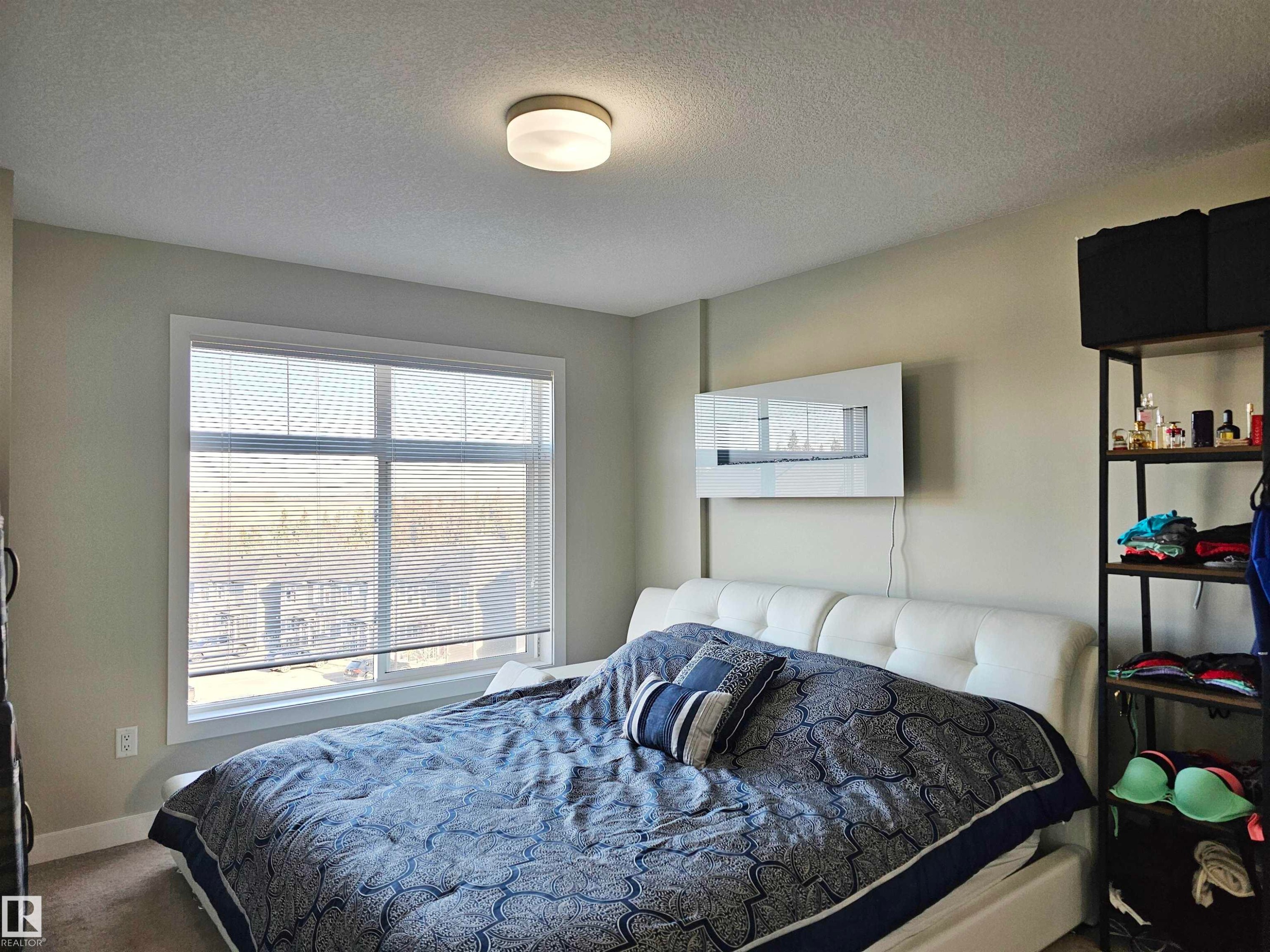 Carpeted bedroom featuring a textured ceiling - 83 600 Bellerose Drive, St. Albert, AB - Indoor Photo Showing Bedroom