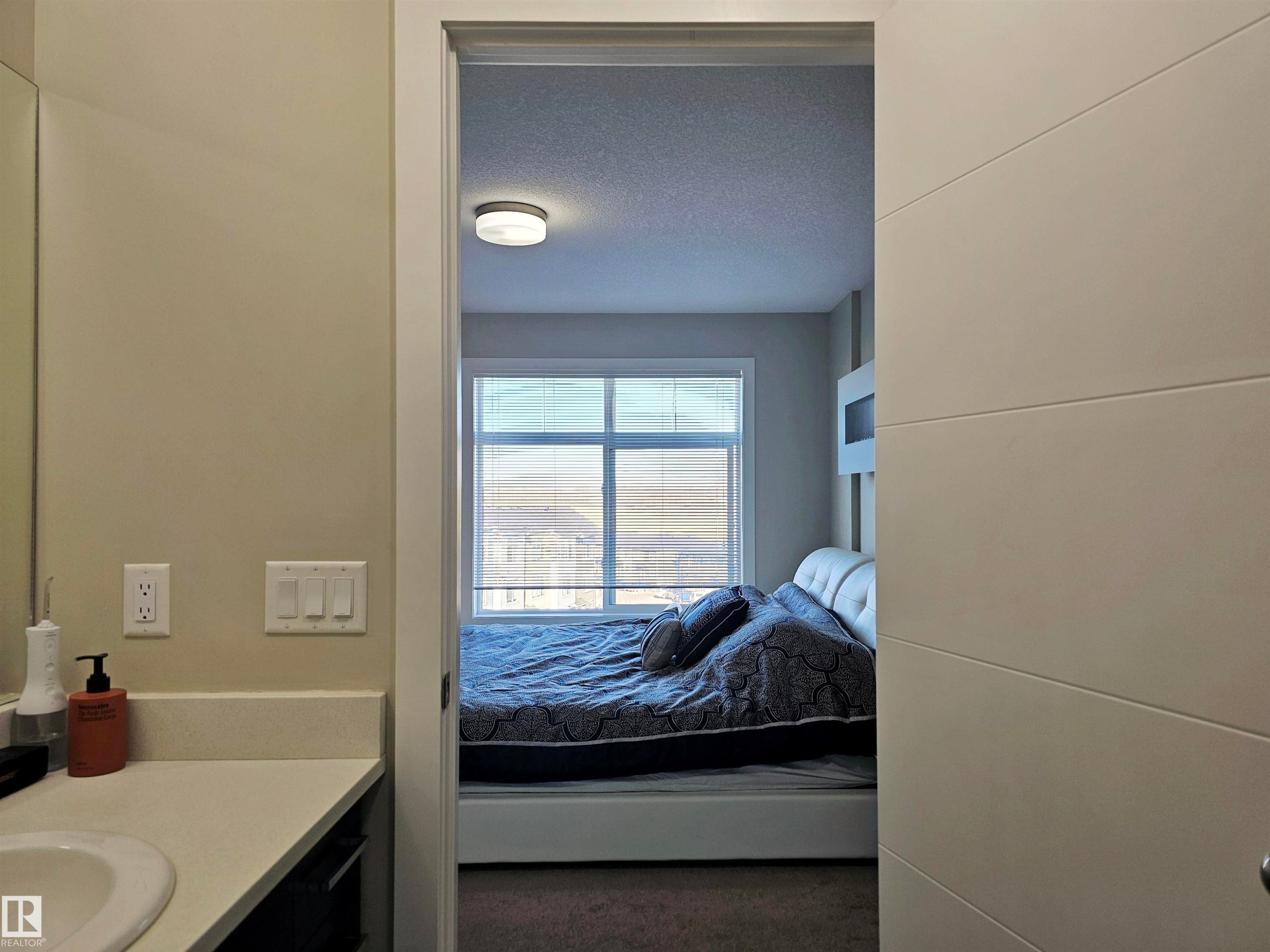Bathroom with vanity, connected bathroom, and a textured ceiling - 83 600 Bellerose Drive, St. Albert, AB - Indoor Photo Showing Bathroom
