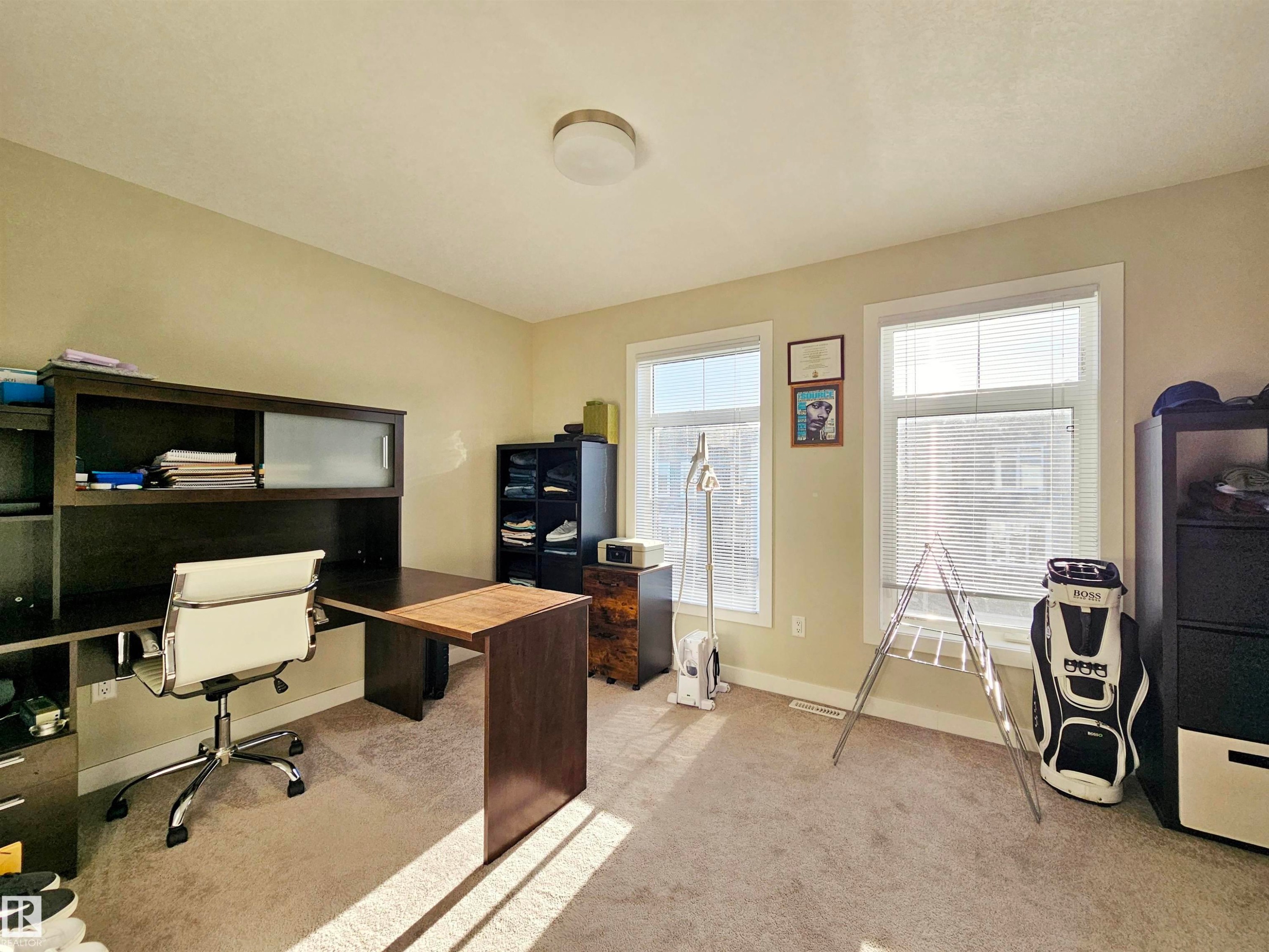 Office area featuring light carpet and baseboards - 83 600 Bellerose Drive, St. Albert, AB - Indoor Photo Showing Office