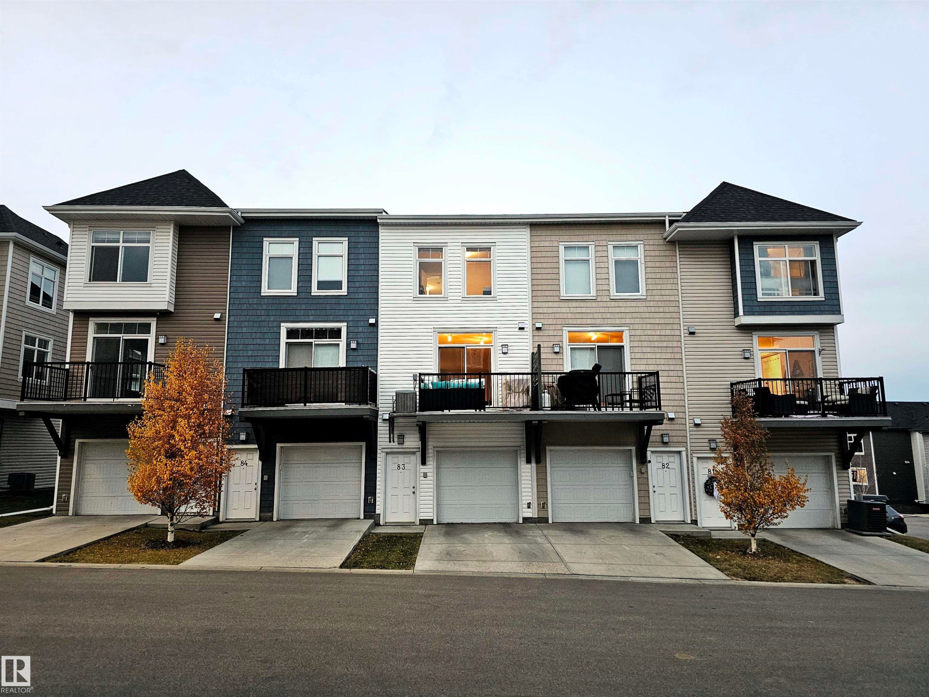 View of front of property featuring a balcony and driveway - 83 600 Bellerose Drive, St. Albert, AB - Outdoor With Deck Patio Veranda With Facade