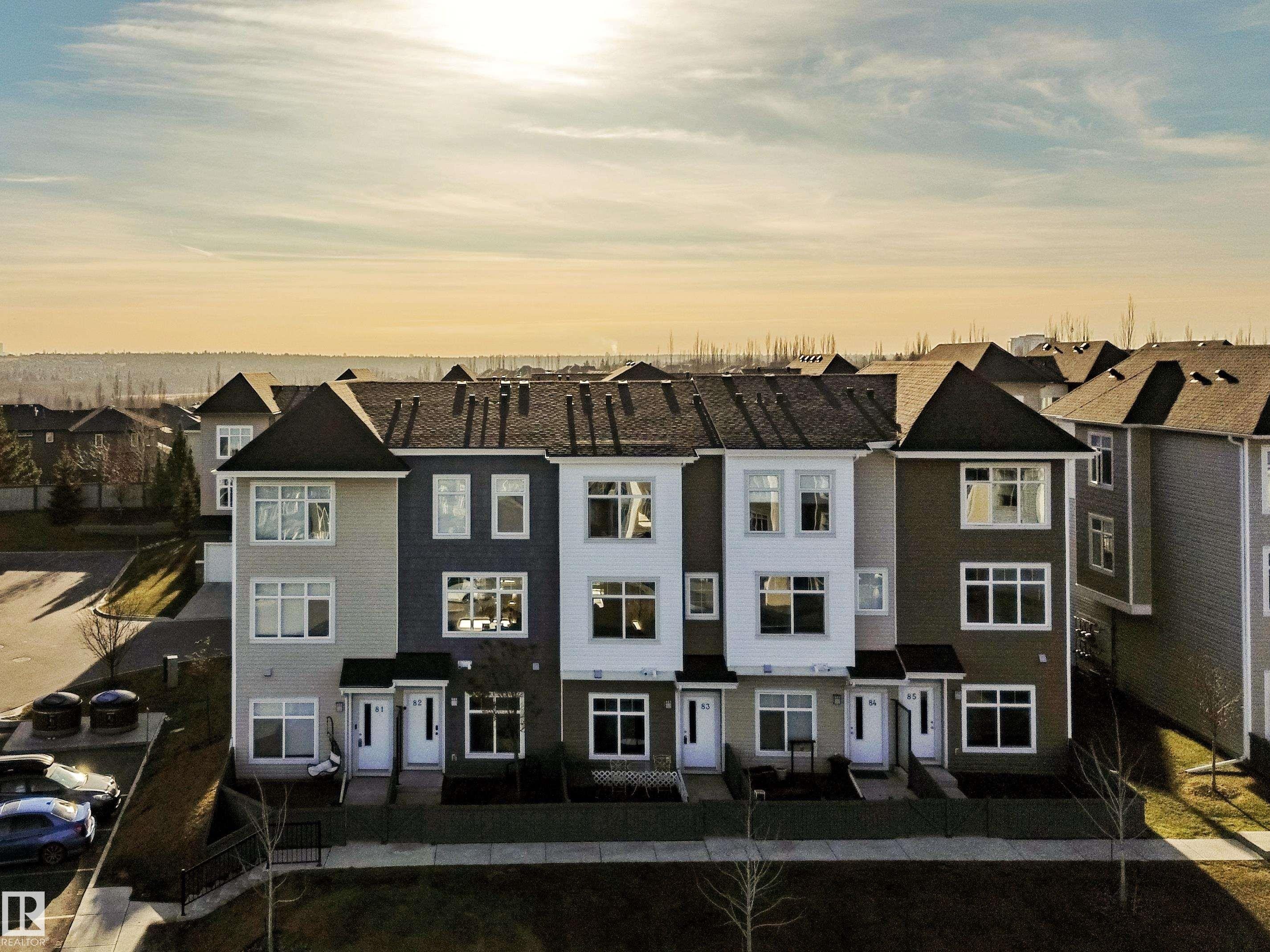 Back of house at dusk with a residential view - 83 600 Bellerose Drive, St. Albert, AB - Outdoor With Facade
