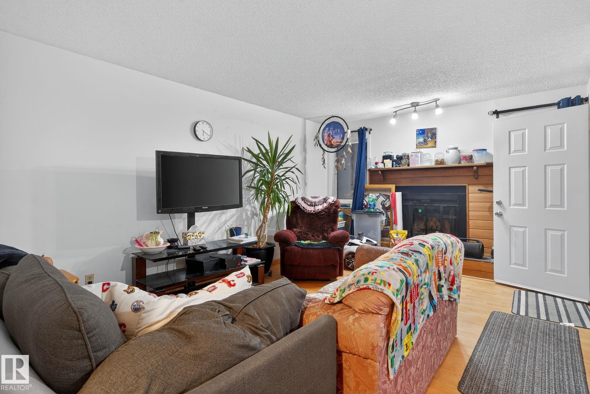 77 7604 29 Avenue, Edmonton, AB - Indoor Photo Showing Living Room With Fireplace